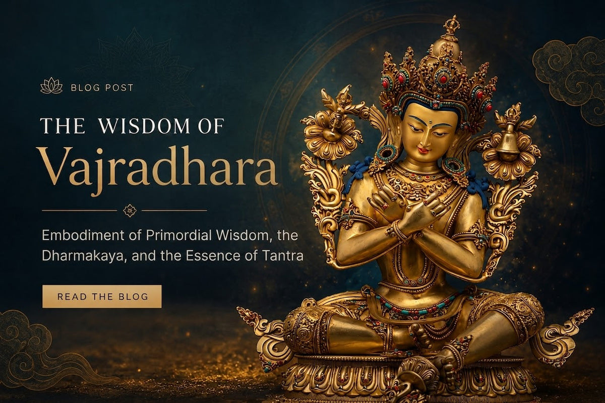 “Vajradhara Buddhist deity statue seated in meditation, adorned with an ornate gold crown and jeweled ornaments, with hands crossed at the heart holding vajra and bell.”