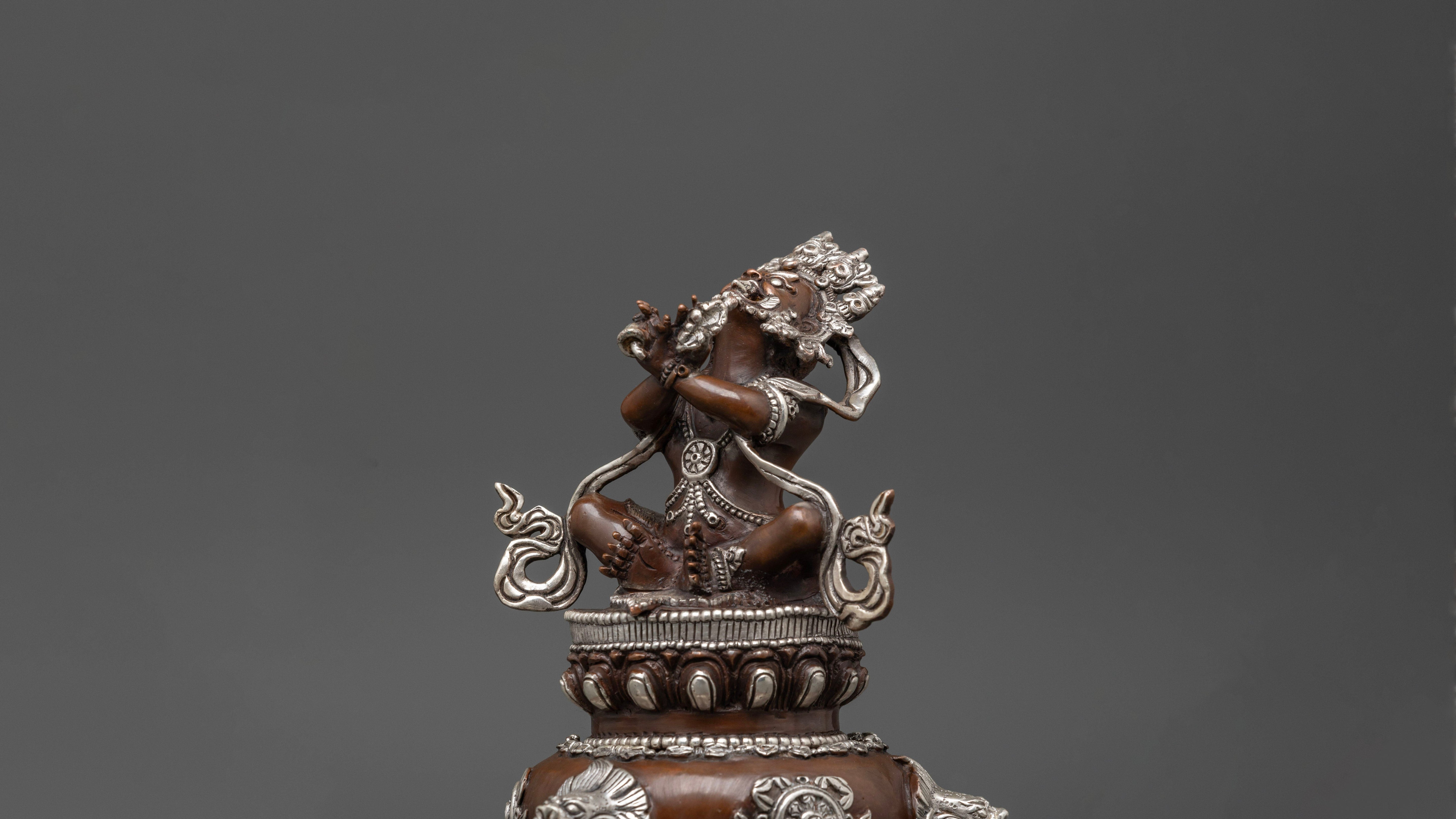 Vajradhaka statue made up of oxidized copper and with silver accents on some parts