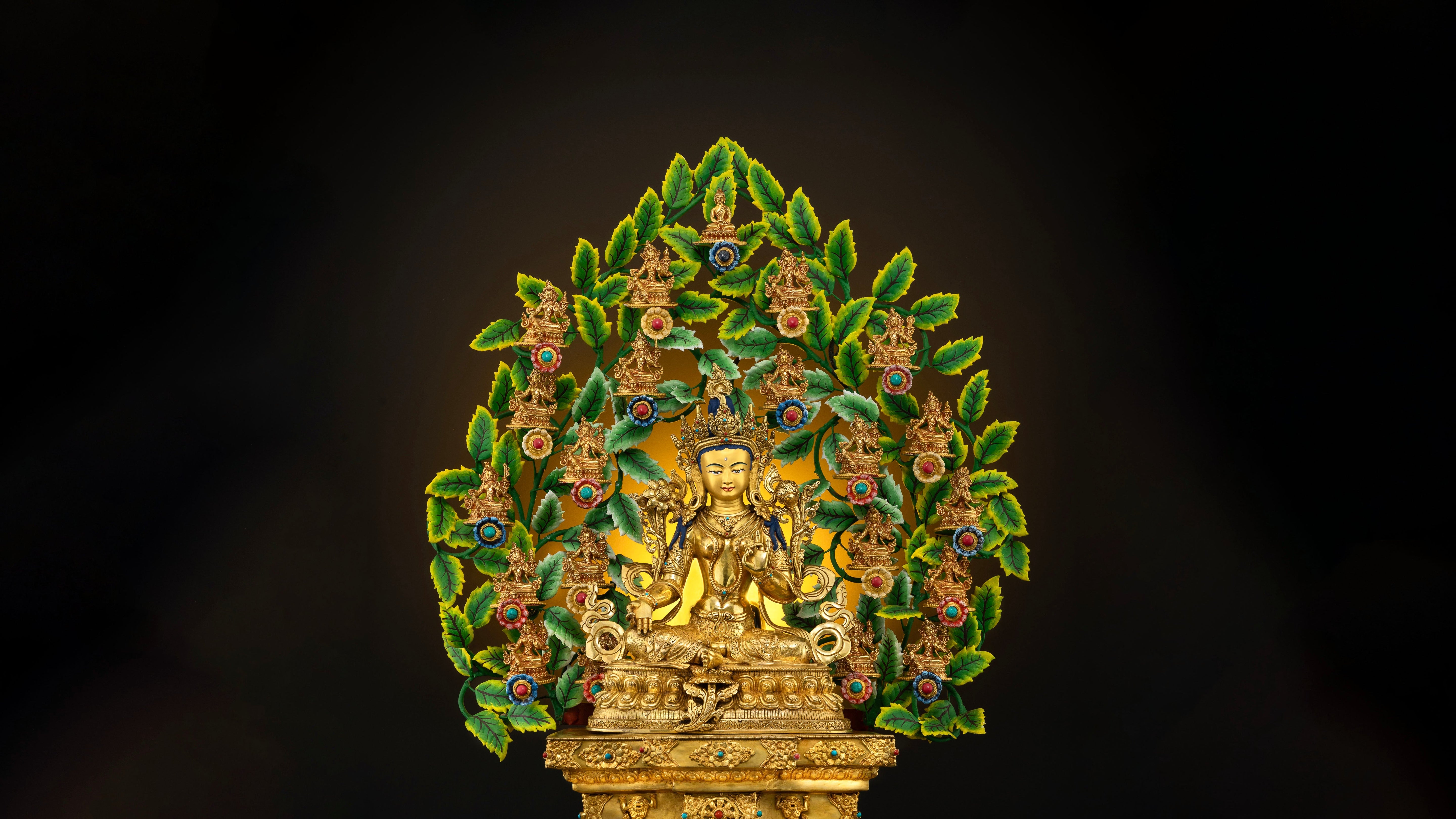 VIbrant golden 21 Tara set statue with bright green colors for the leaves which are seen at the background of the big main statue