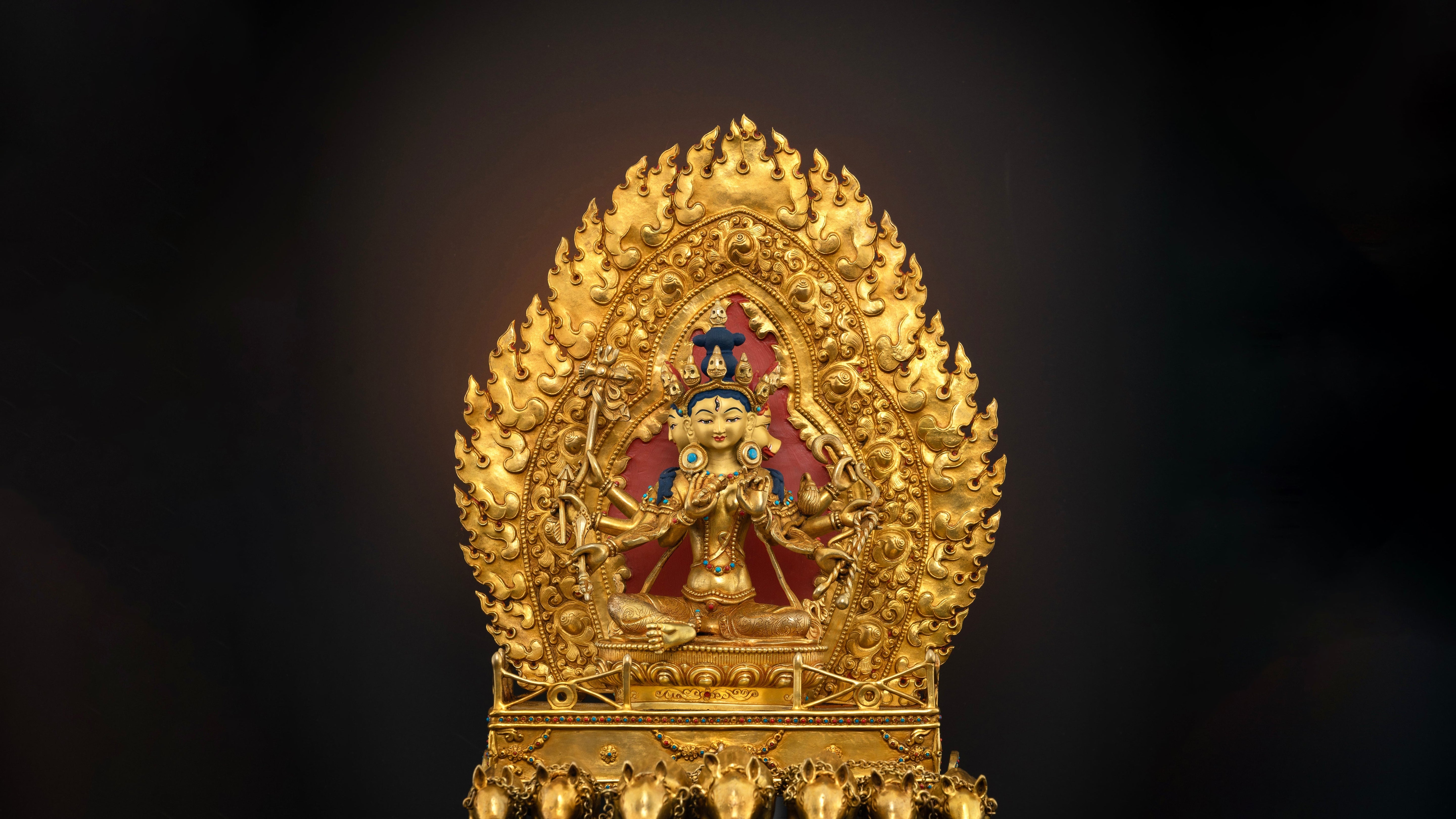 golden Marichi statue sitting graciously on her throne