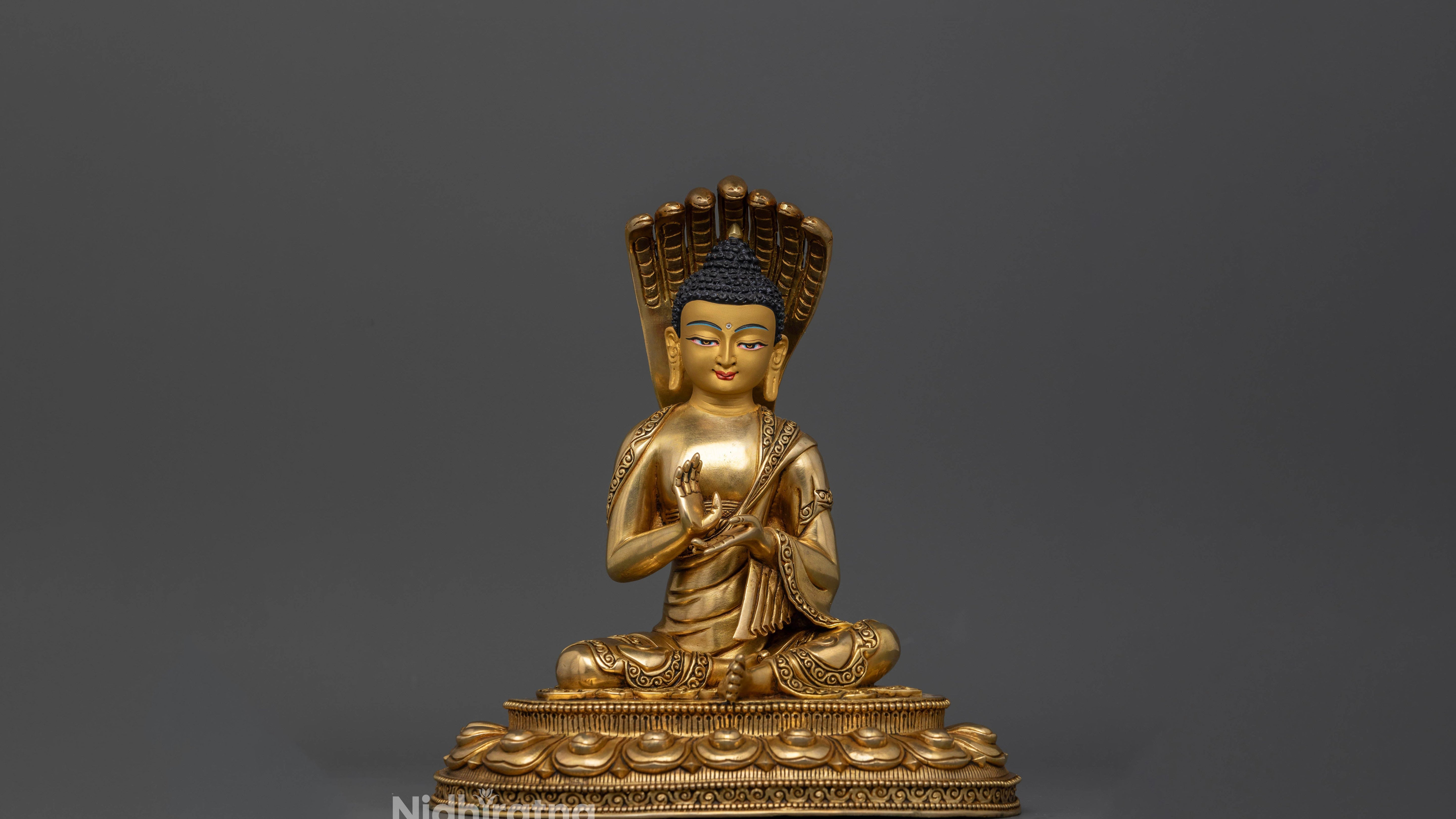 golden Nagarjuna statue with Abhaya mudra