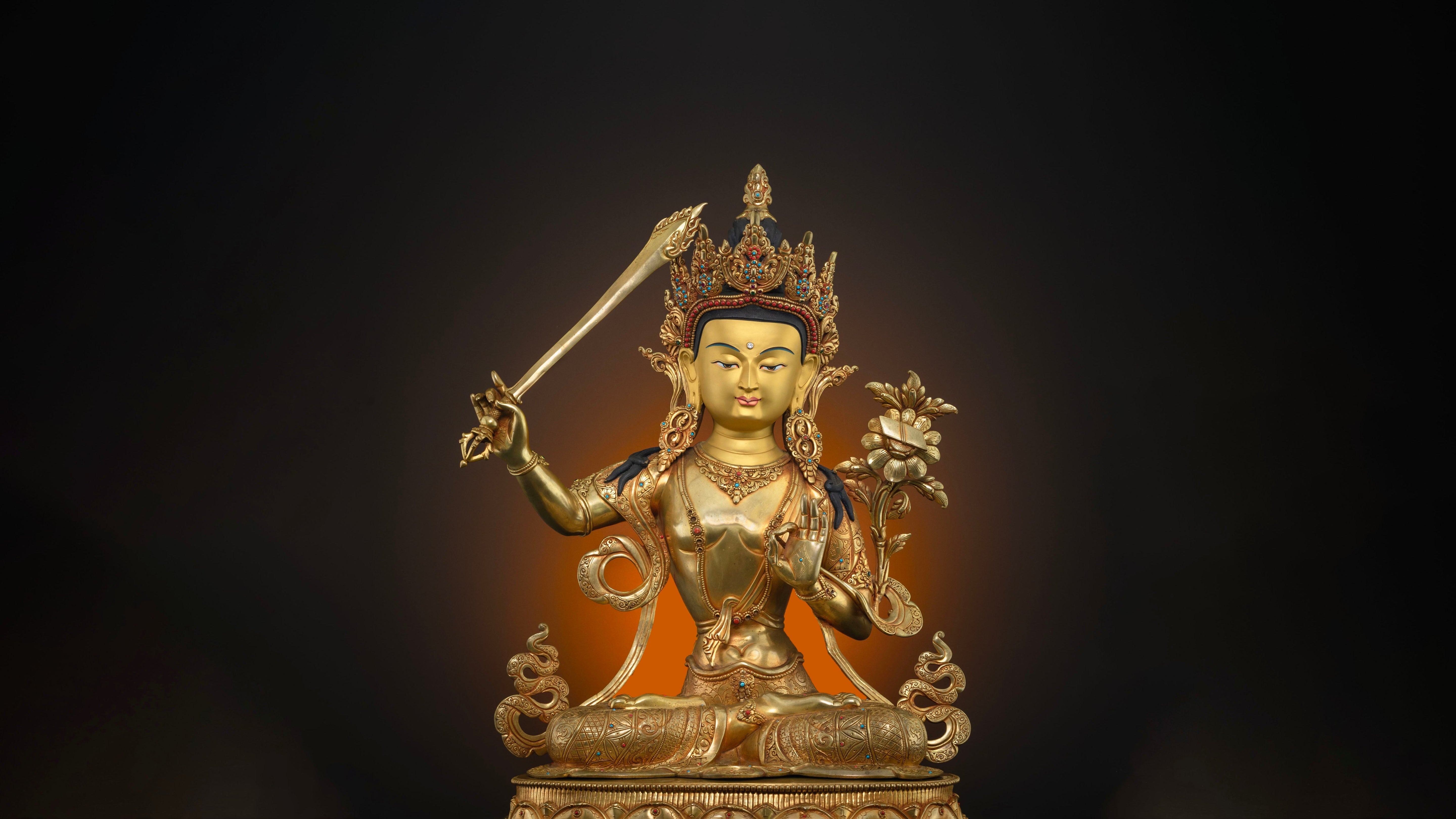The great Bodhisattva- Manjushri statue with bright coated gold and painted with poster and acrylic colors for accents