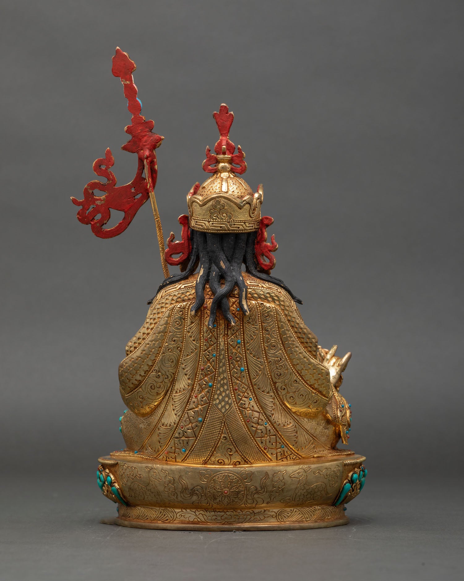 Back view of Guru Rinpoche with consorts statue showing lotus throne and intricate carvings