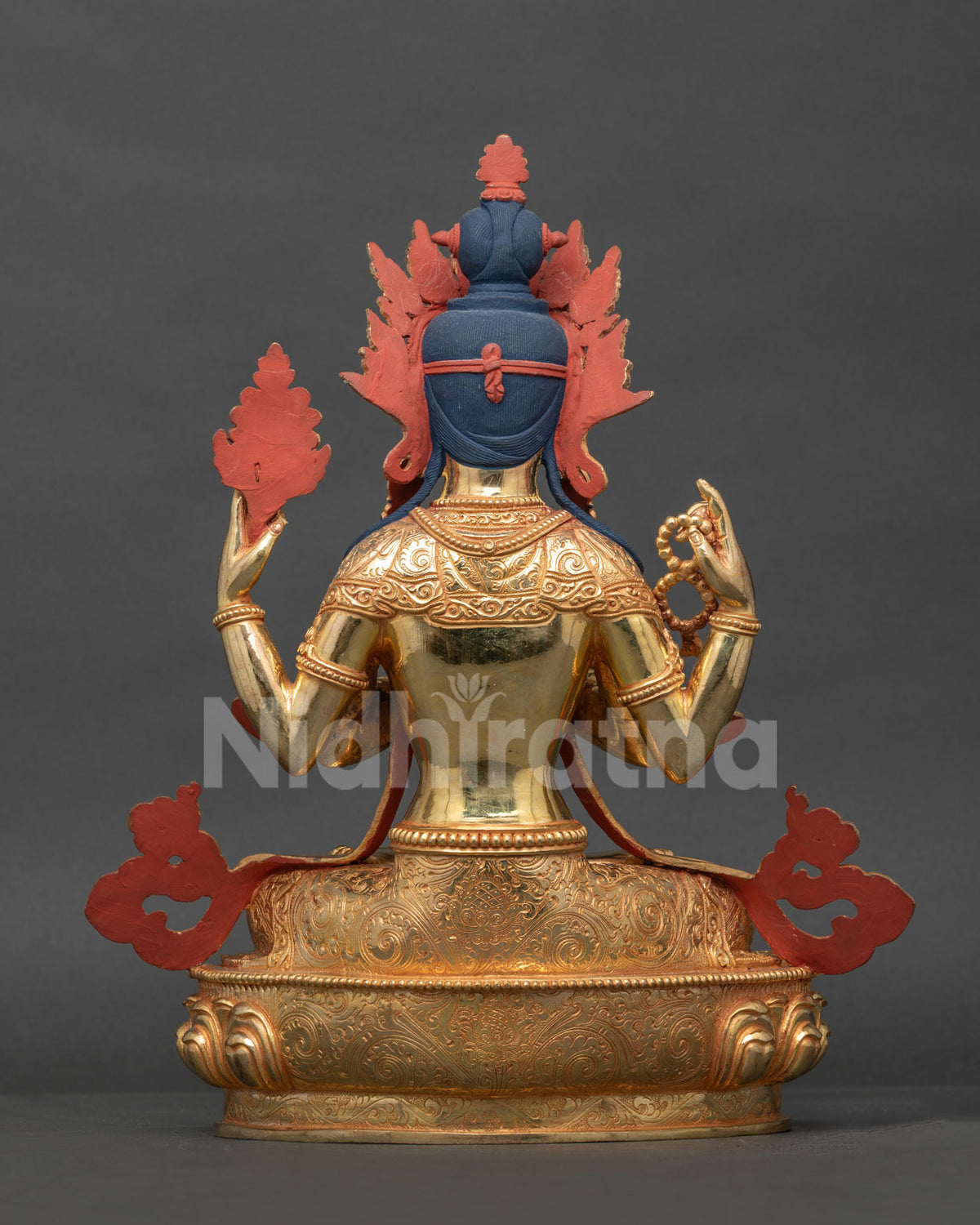 Back view Chenrezig statue showing gold gilded copper details and ornate jewelry.