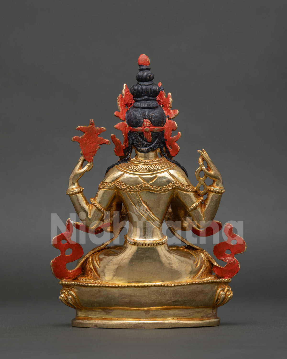 Detailed gold fire gilded chenrezig statue with 24k gold painted face handcrafted in nepal.