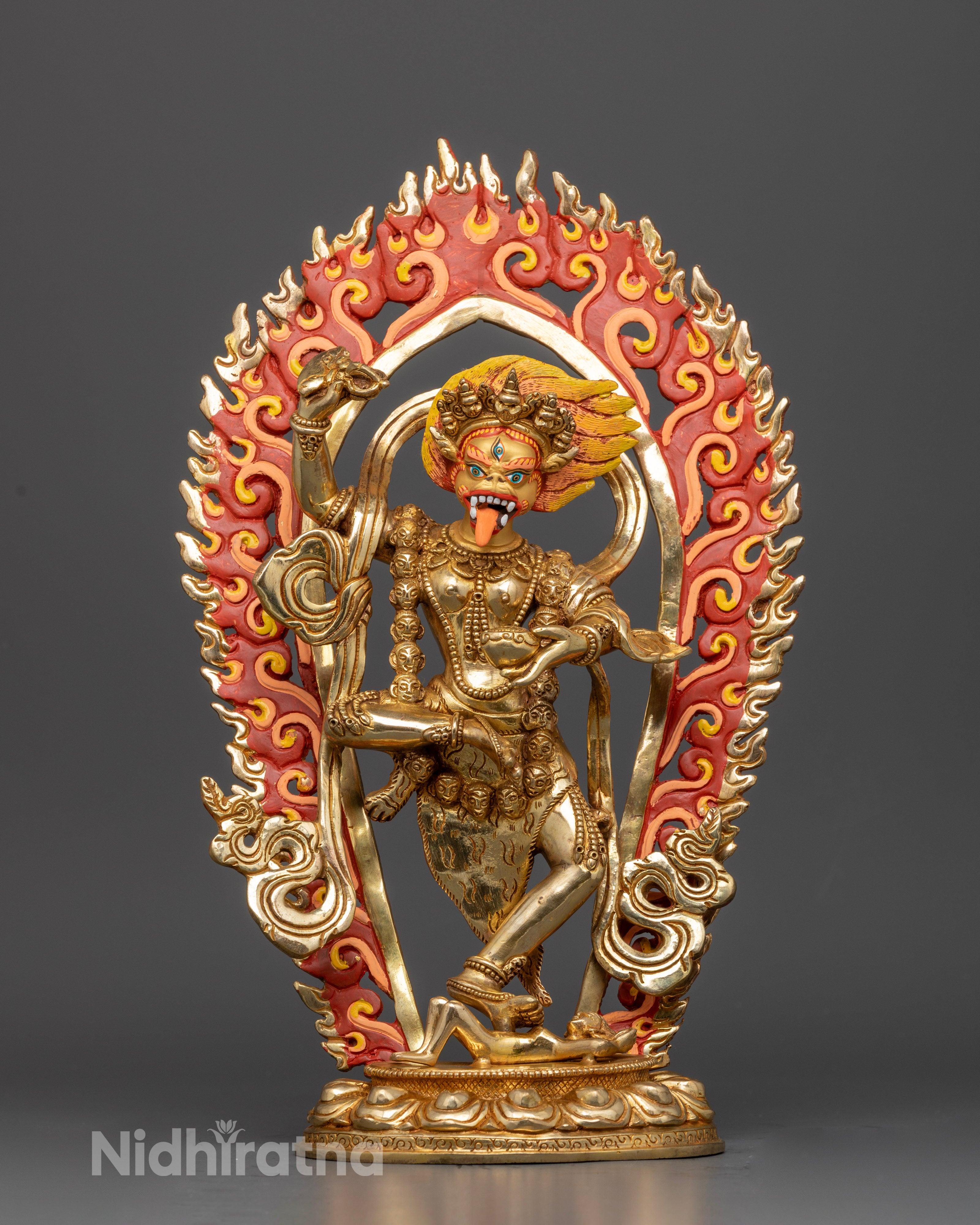 Front view of Simhamukha statue with fire backdrop, hand-carved Tibetan Buddhist artwork