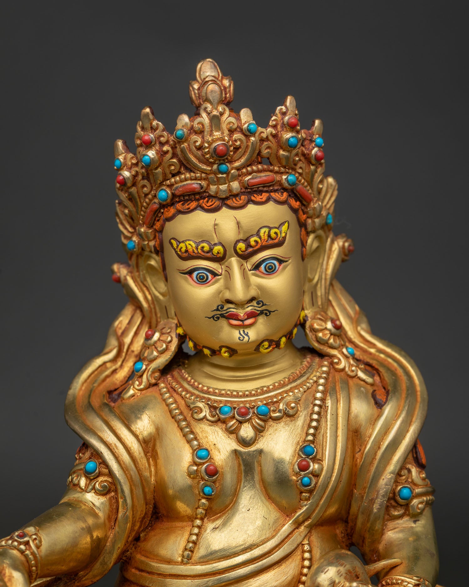 24K gold Dzambhala statue with ornate crown and gemstone inlays