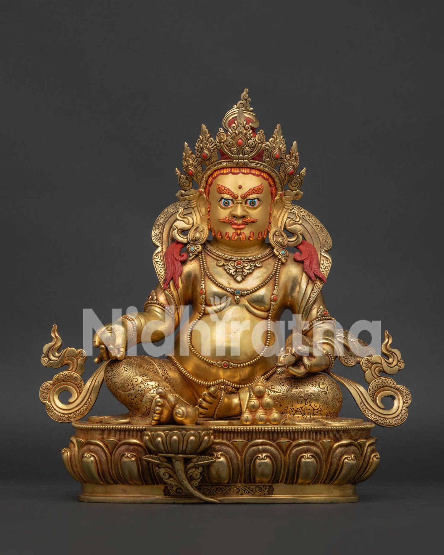 24K gold fire-gilded Yellow Dzambhala statue seated on an ornate lotus pedestal in Nepal