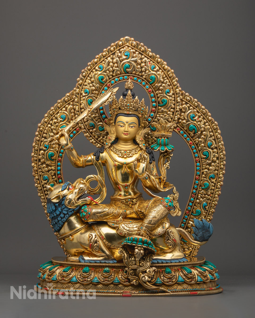 24k gold-gilded Manjushri statue hand-carved in Nepal, featuring gold-gilded face, flaming sword of wisdom, and Prajñāpāramitā Sūtra on lotus.