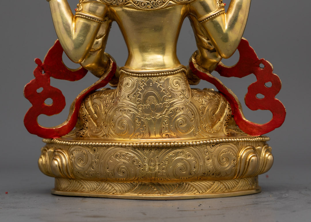 A 24K gold-gilded copper Manjushri statue with a concealed hollow chamber at the base for sacred relics or mantras.