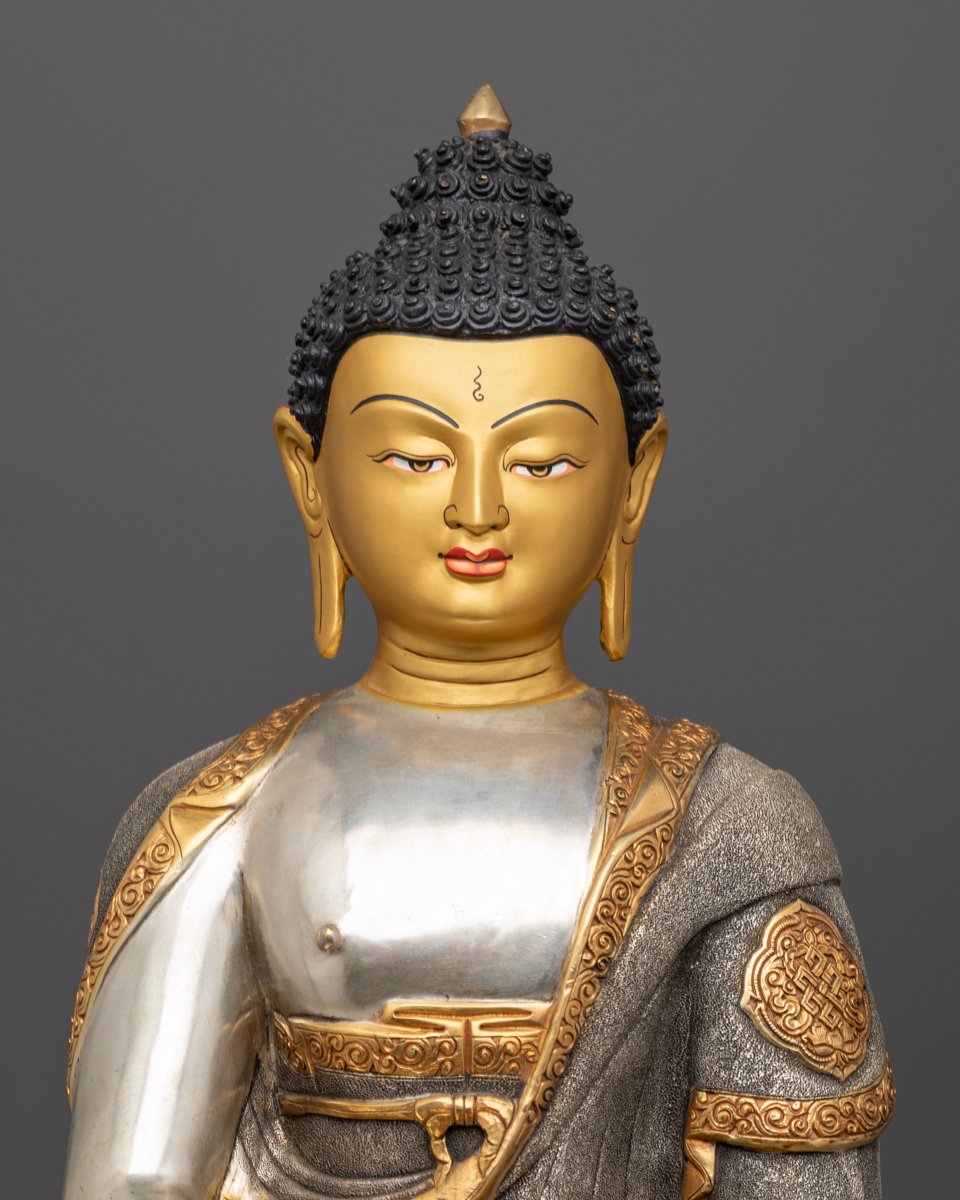 Amitabha Buddha’s peaceful expression and detailed garments, highlighting the intricate craftsmanship and the glowing halo symbolizing enlightenment and infinite light.