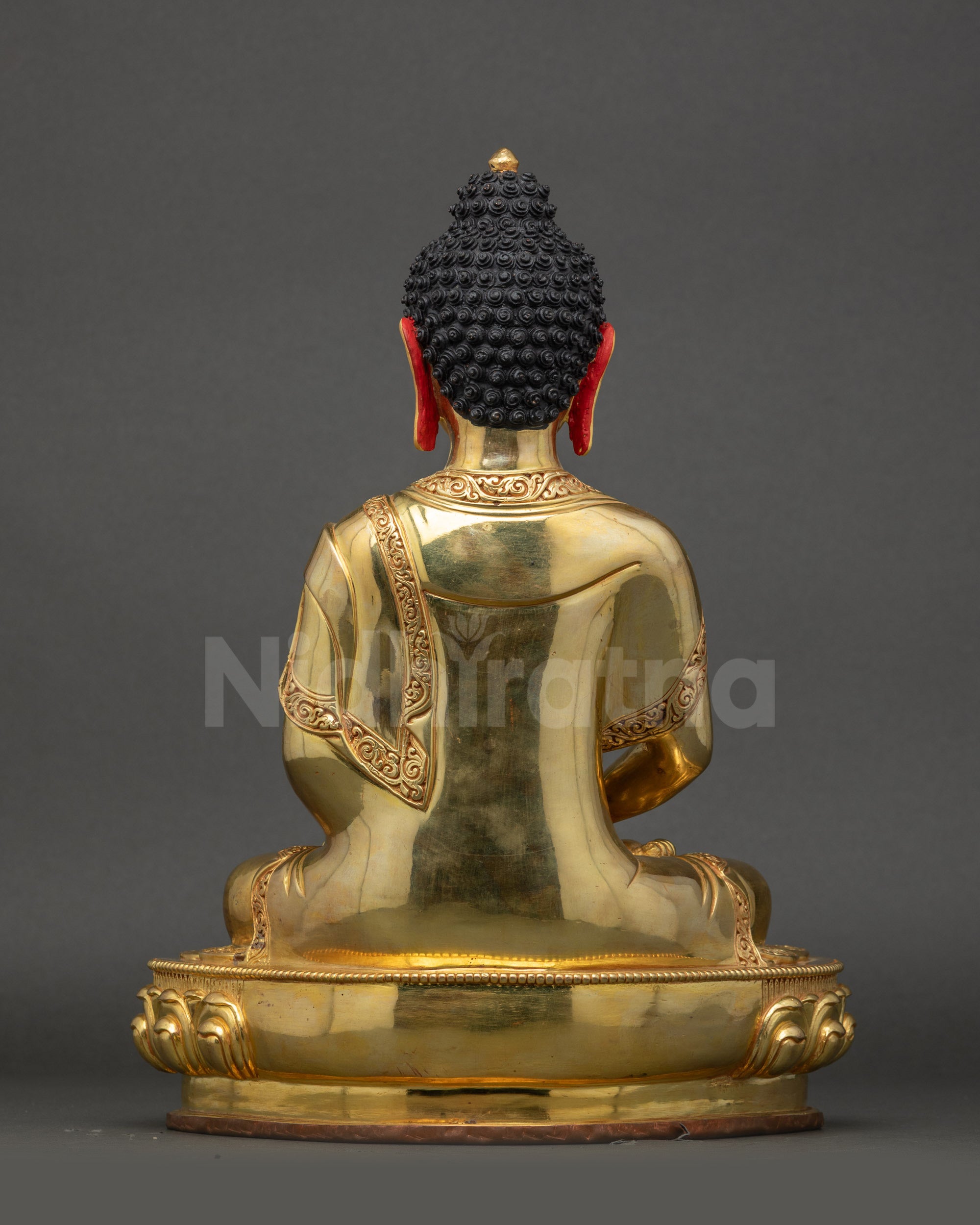 Amitabha Buddha statue back showing monastic robes and gold detailing