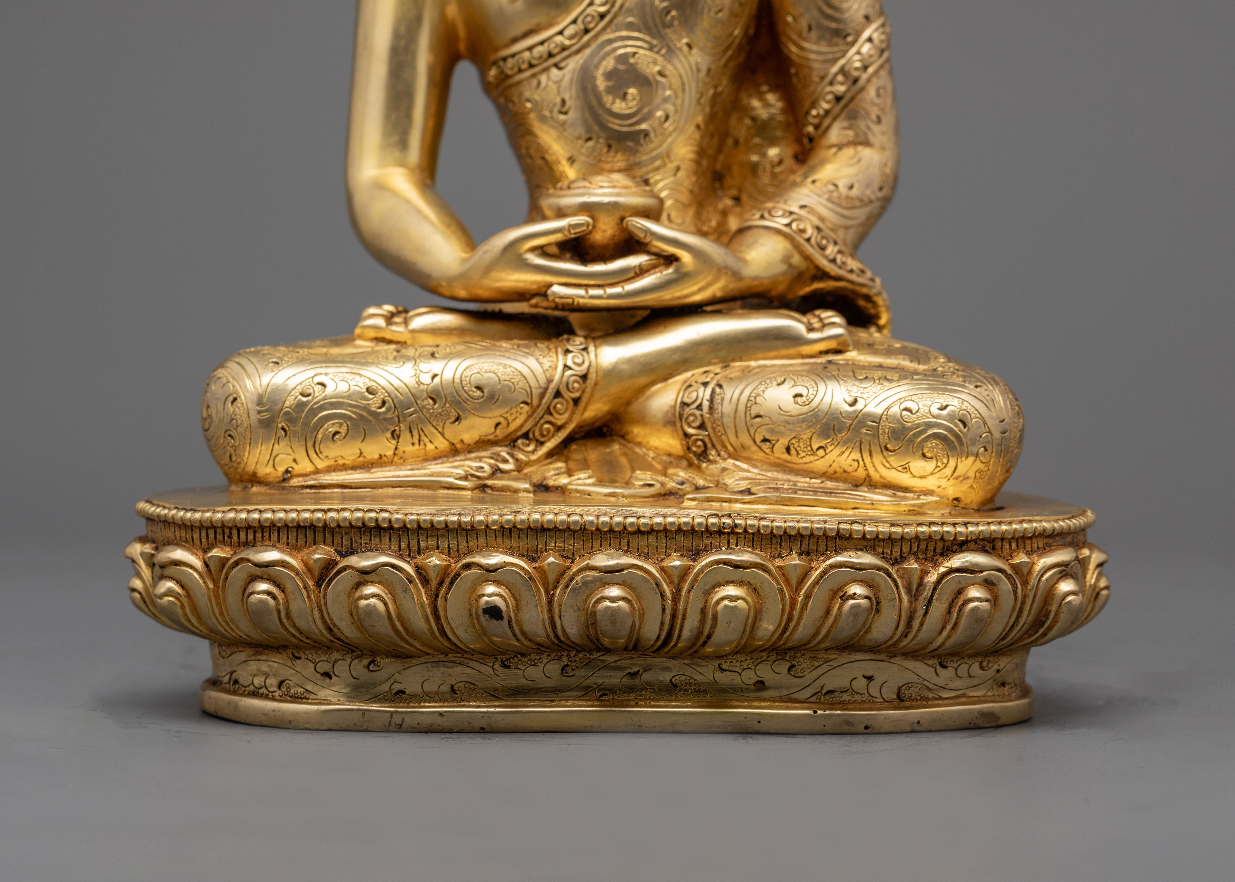 Amitabha Buddha statue seated in meditation posture with vibrant acrylic detailing