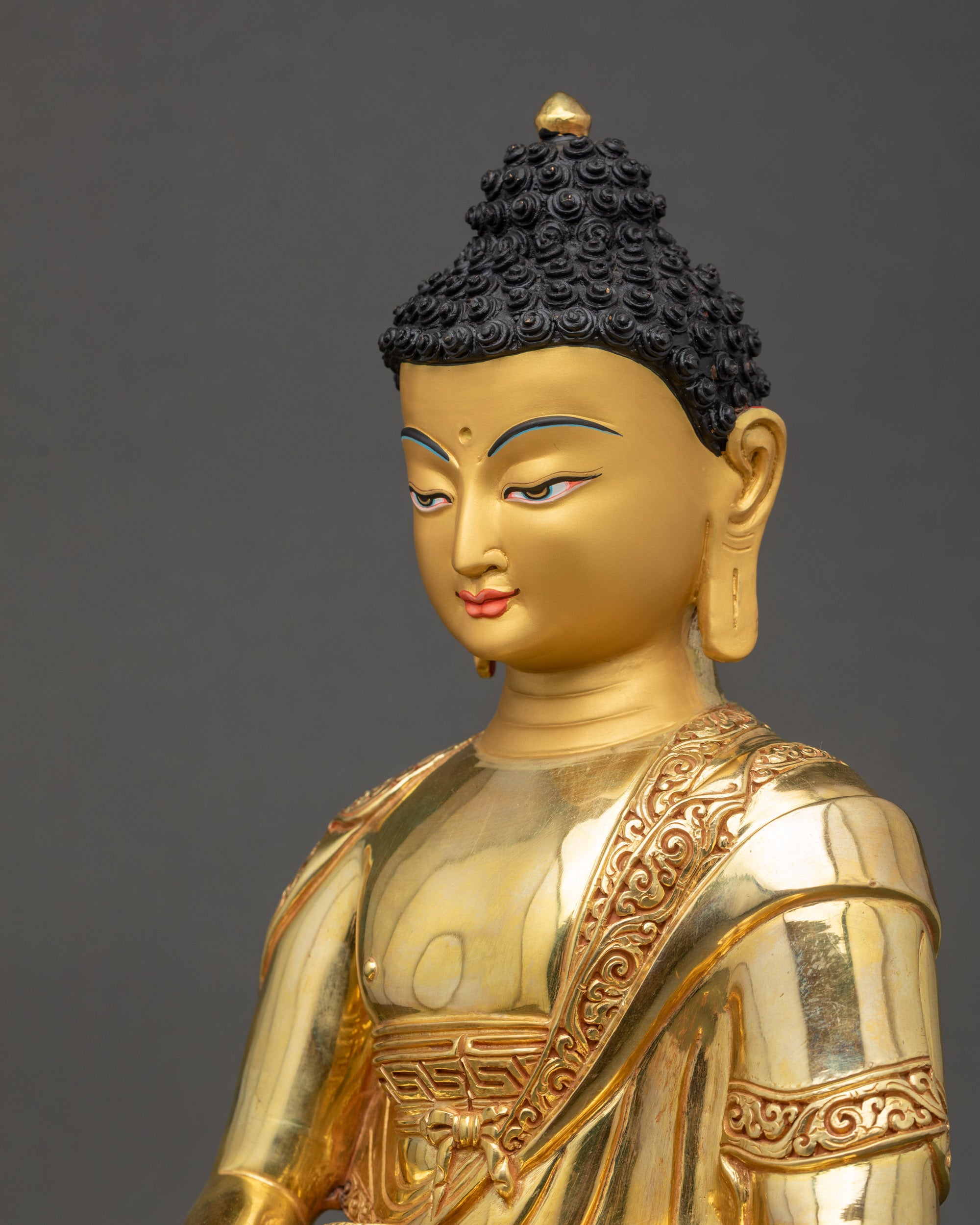 Amitabha Buddha statue side close up showing flowing monastic robes