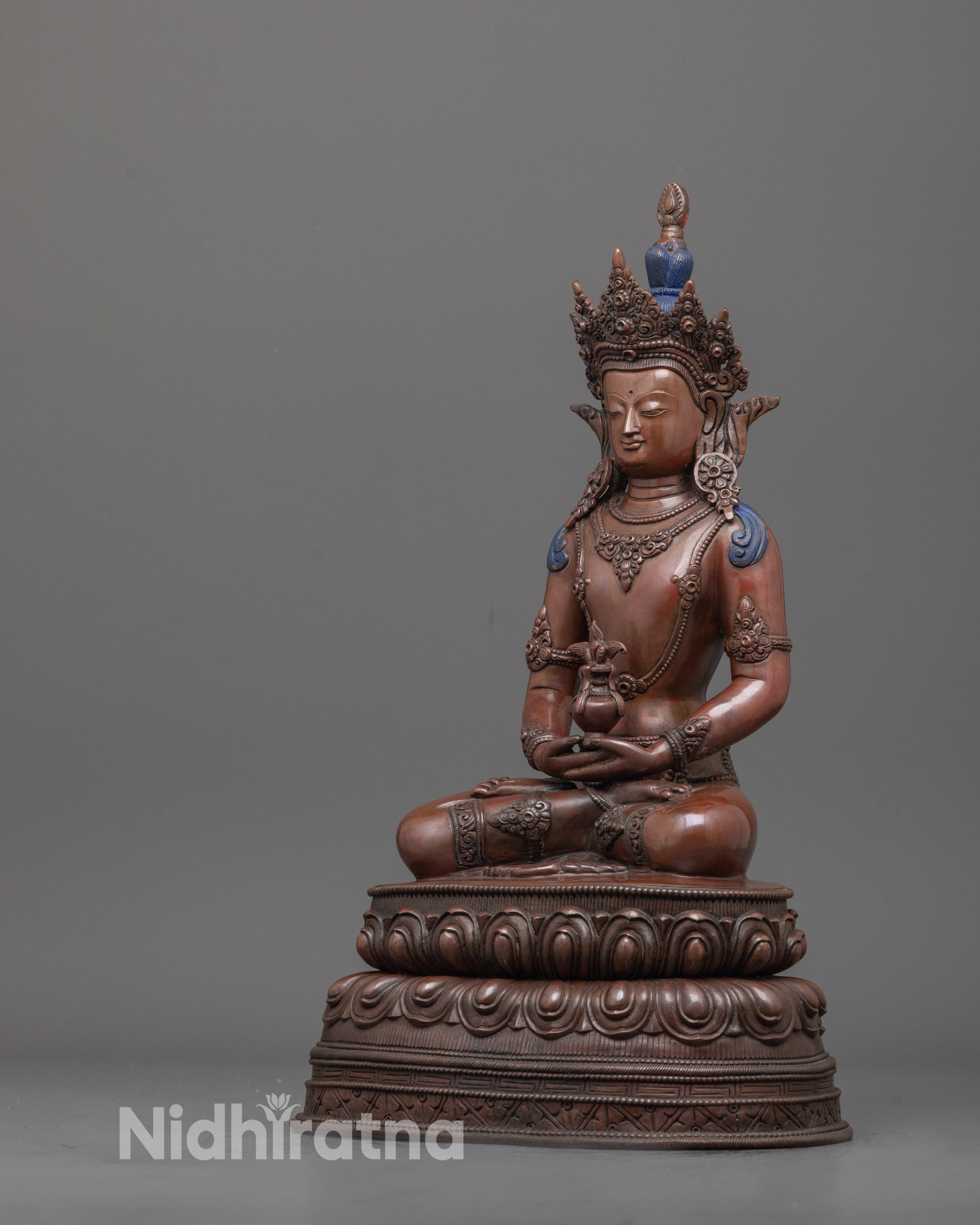 back view of handcrafted Amitayus statue showing detailed robe work and lotus base carvings