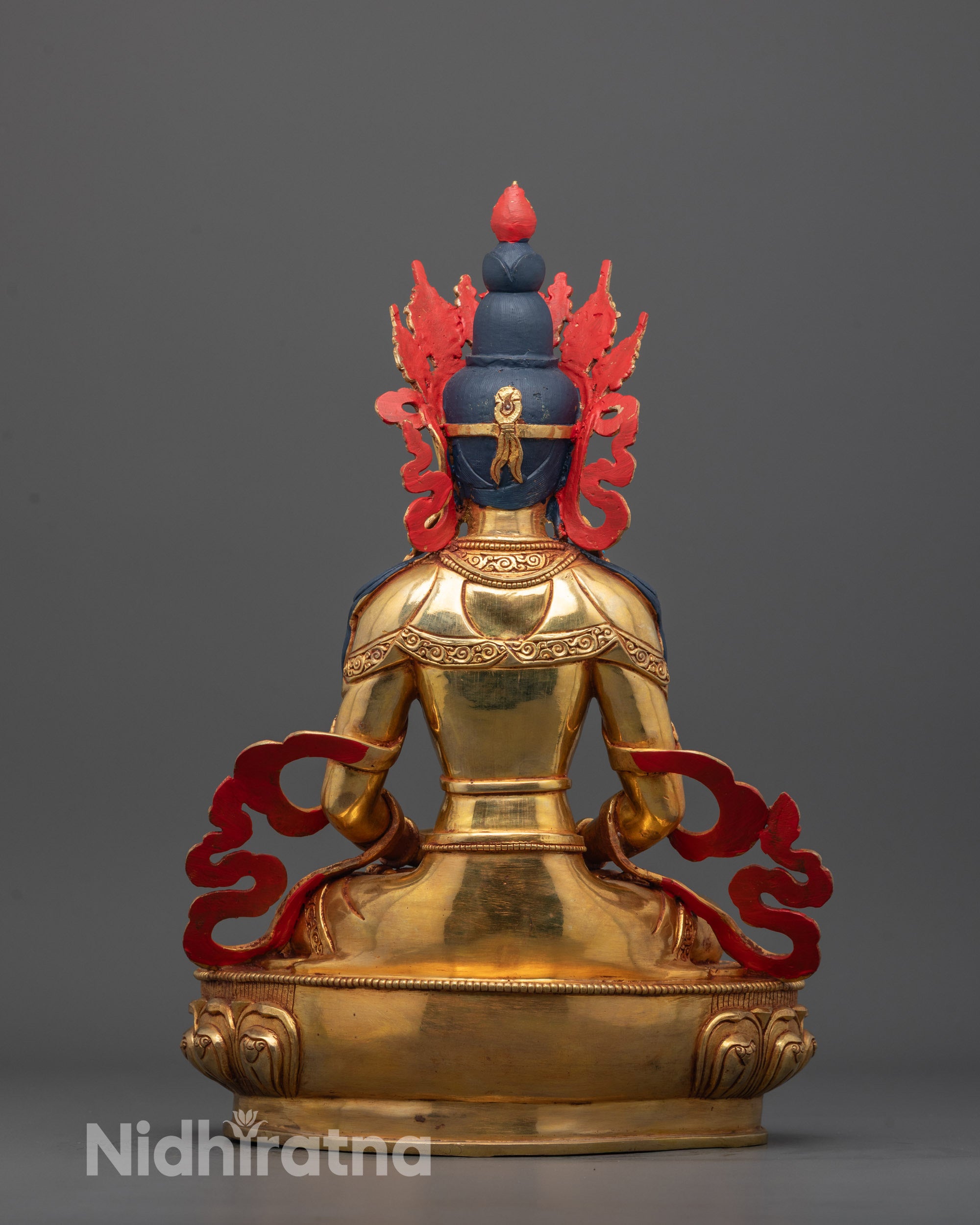 Back view of Amitayus Statue highlighting intricate carvings and hollow lotus throne section