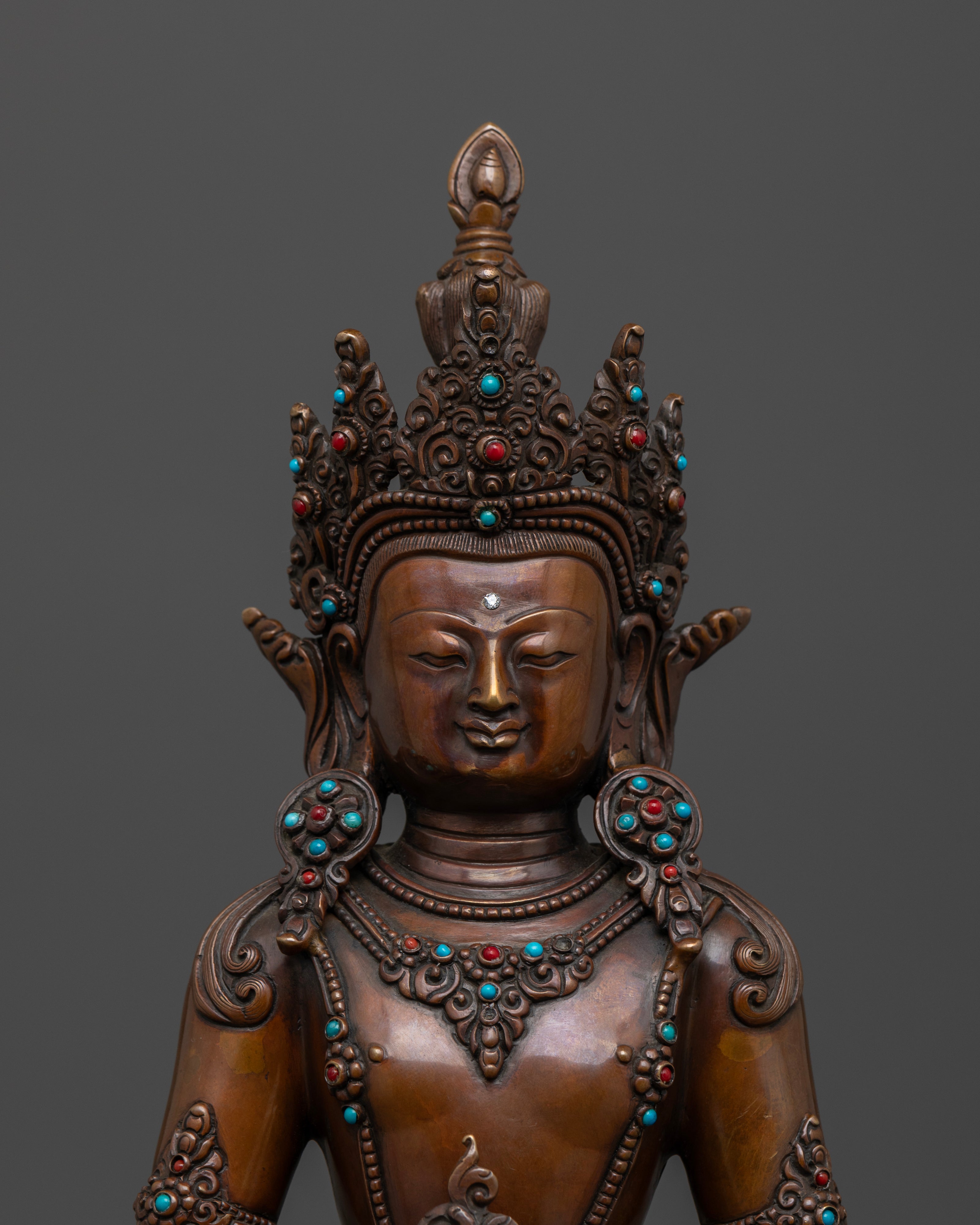 face of Amitayus Buddha statue which is brown color due to oxidized copper