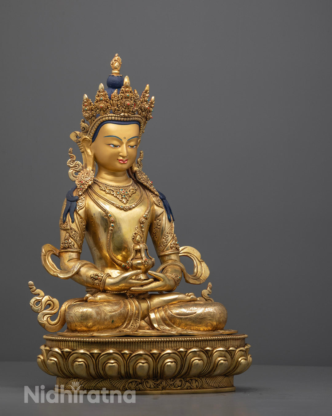 Amitayus statue featuring a hollow consecration chamber for inserting sacred mantras and relics, highlighting spiritual significance.