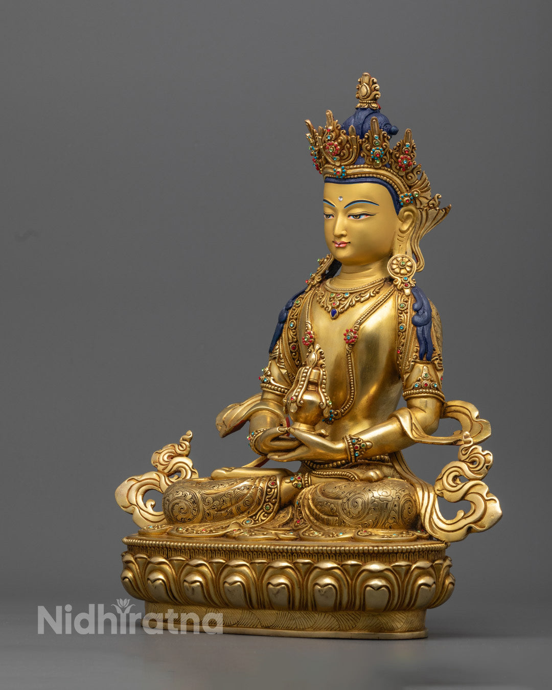 Amitayush Buddha statue in gold, symbolizing longevity, wisdom, and the power to overcome obstacles to health and vitality.