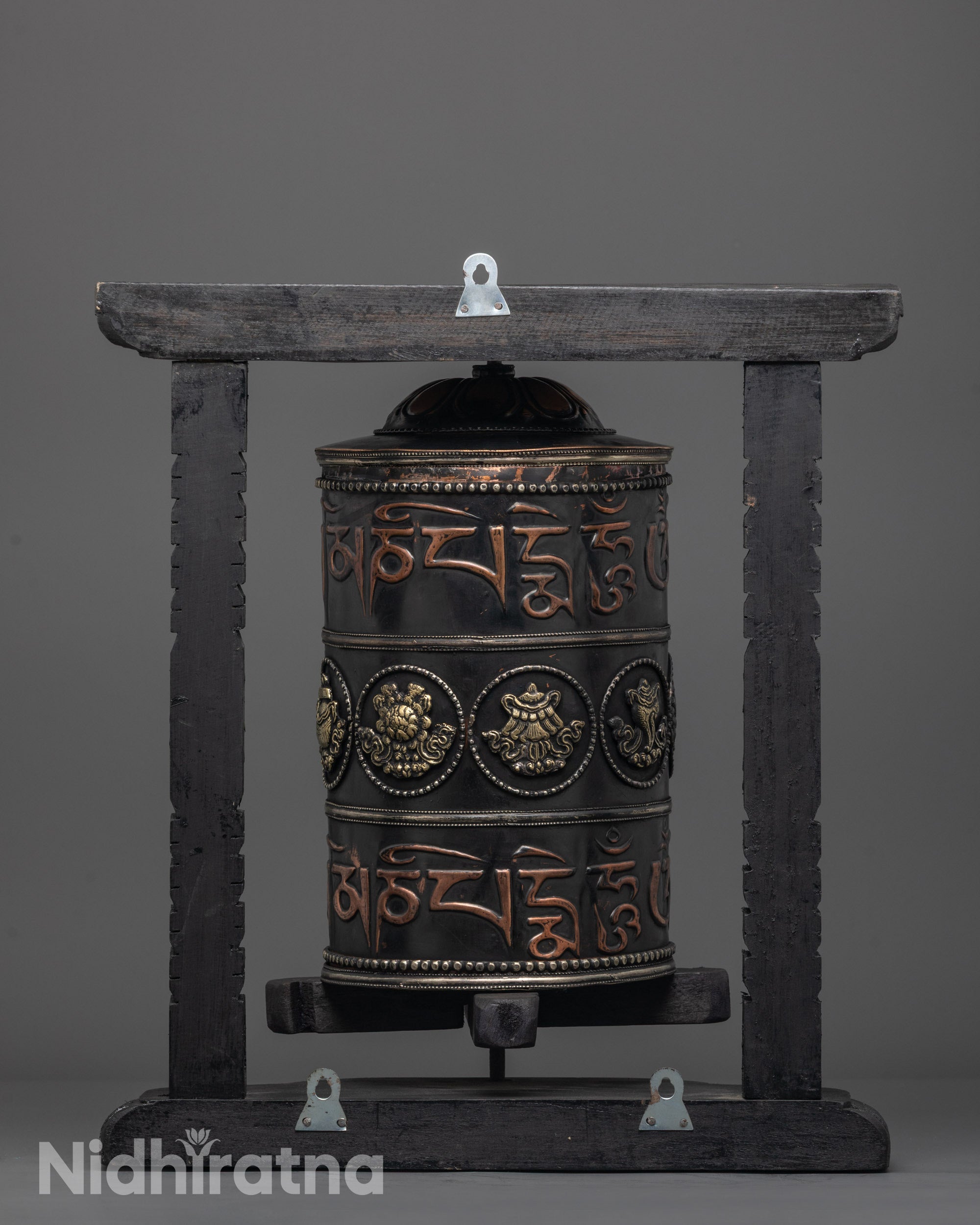 Artisan-crafted Tibetan prayer wheel spinning for blessings and spiritual protection