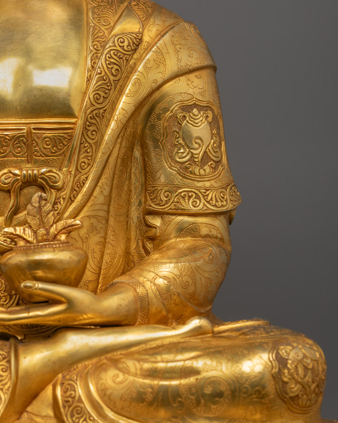 Artisan sculpting Medicine Buddha statue in Patan Nepal workshop