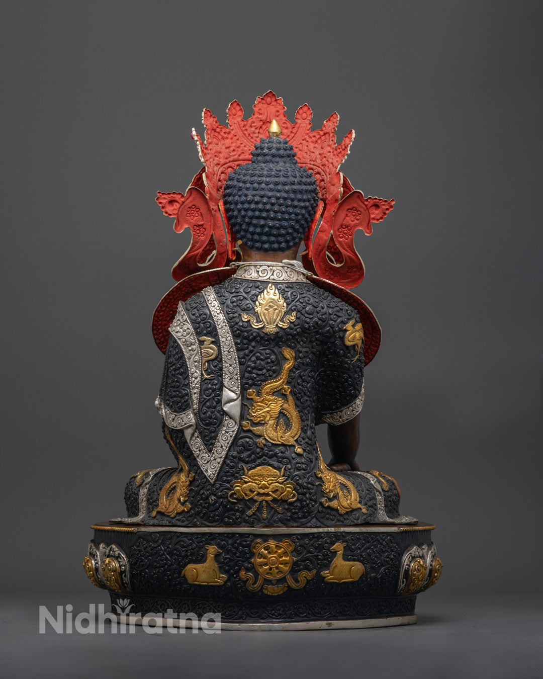 Back view of Authentic Jowo Rinpoche statue with radiant 24k gold face and oxidized copper body