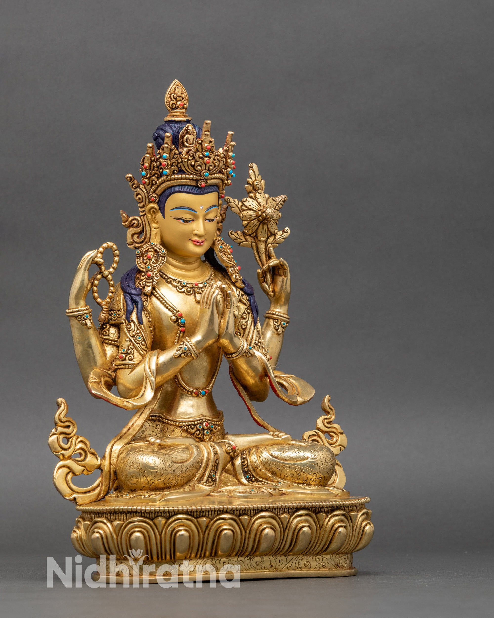 Avalokiteshvara statue right side showing one arm position and floral carved details