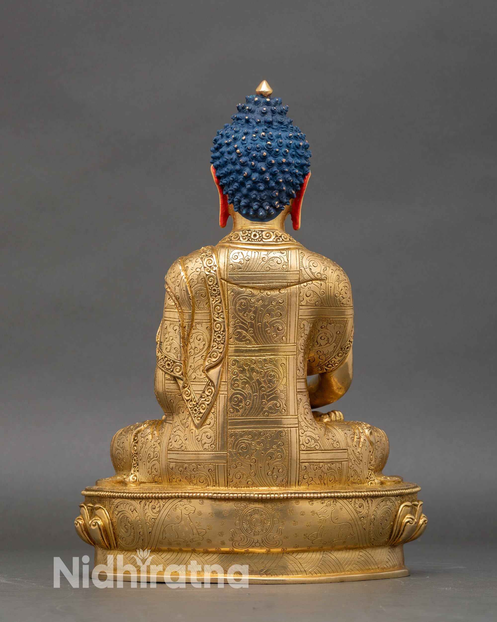 Back view of Amitabha Buddha statue with double-lotus throne and carved petal details