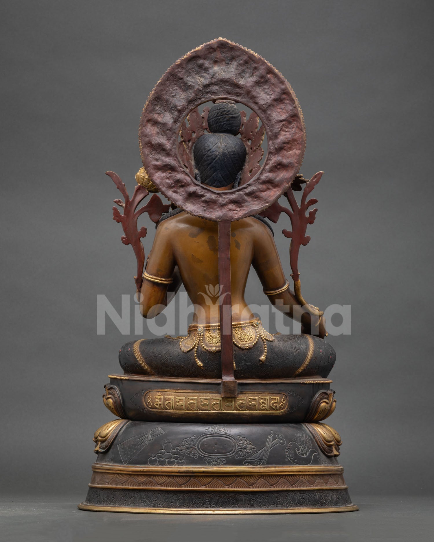 Back view Green Tara statue, carved details, layered lotus seat, copper patina