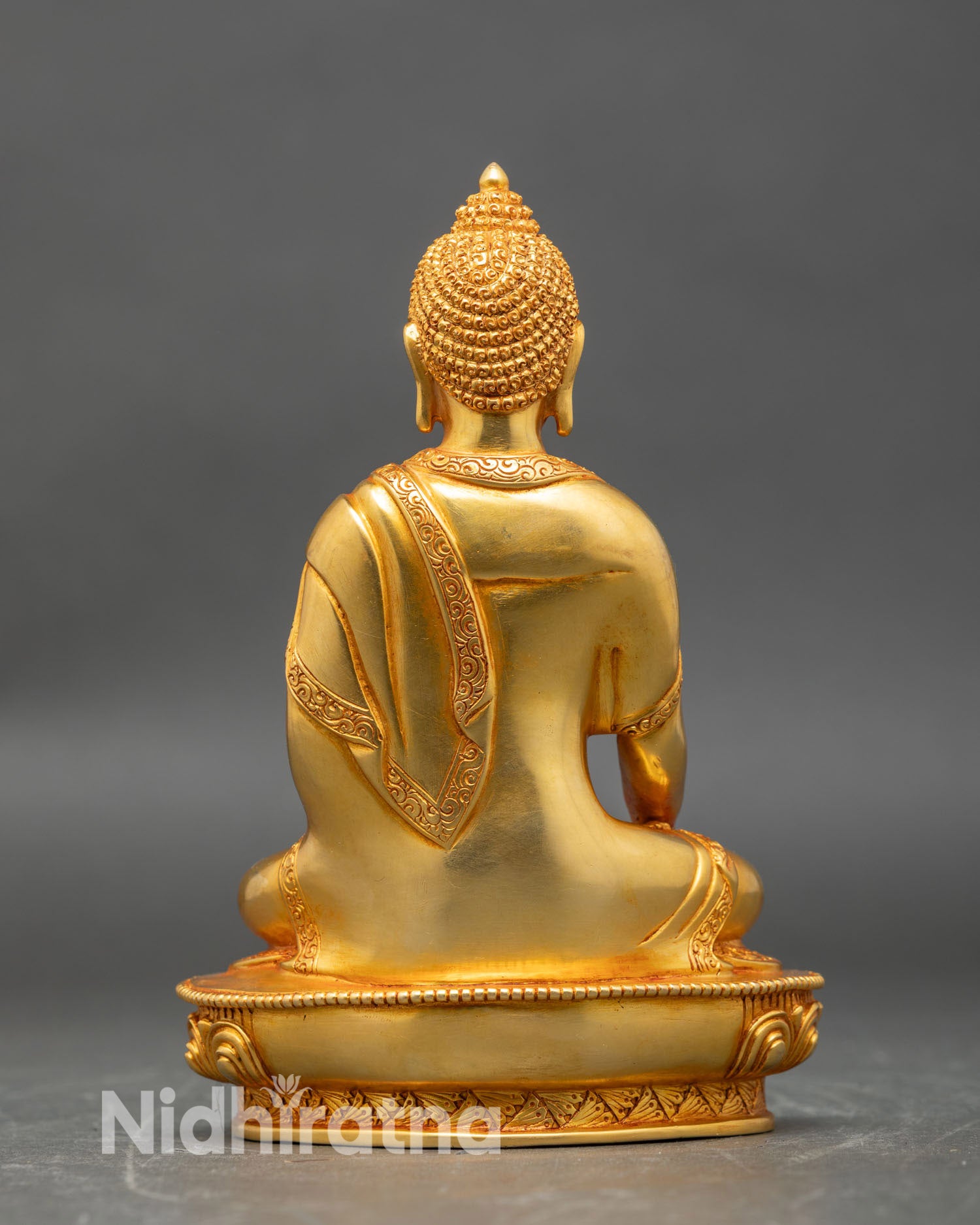 Back view of Mitrugpa statue flowing robes hand-carved details gold gilded Tibetan art