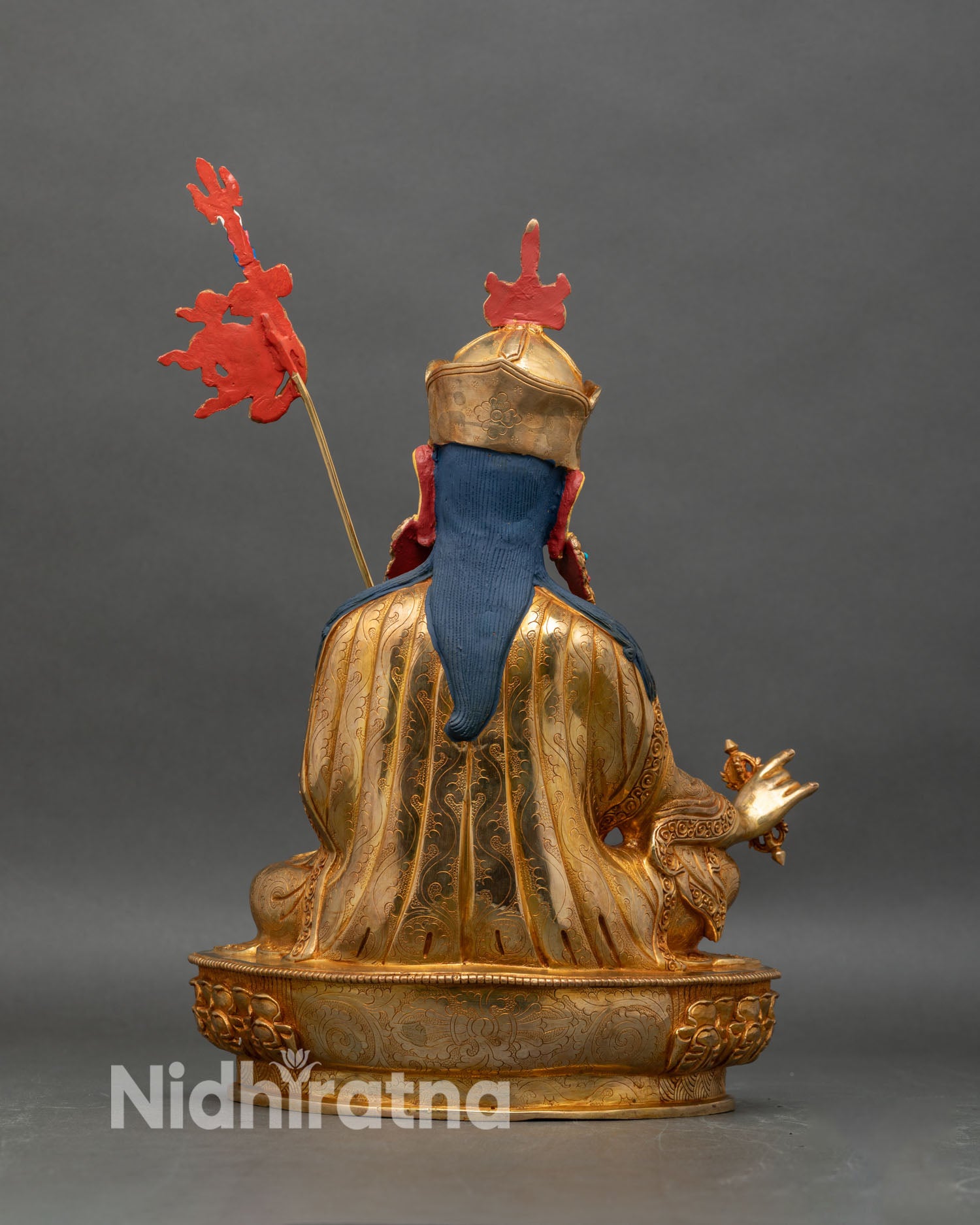 Back view of Guru Rinpoche statue, lotus base with ornate repoussé work
