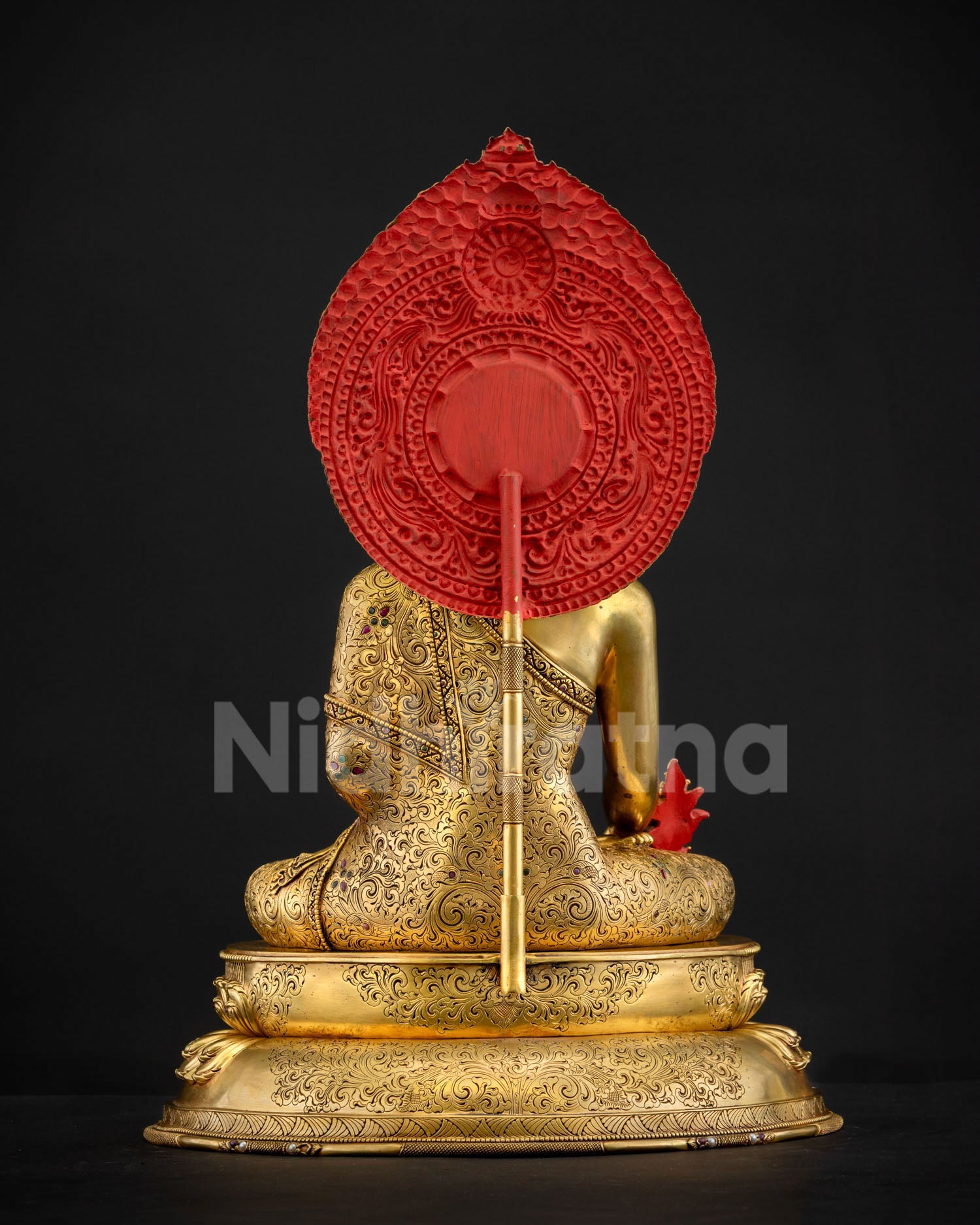 Back view of Medicine Buddha statue with hand-chased scrolling floral halo and traditional Newari craftsmanship