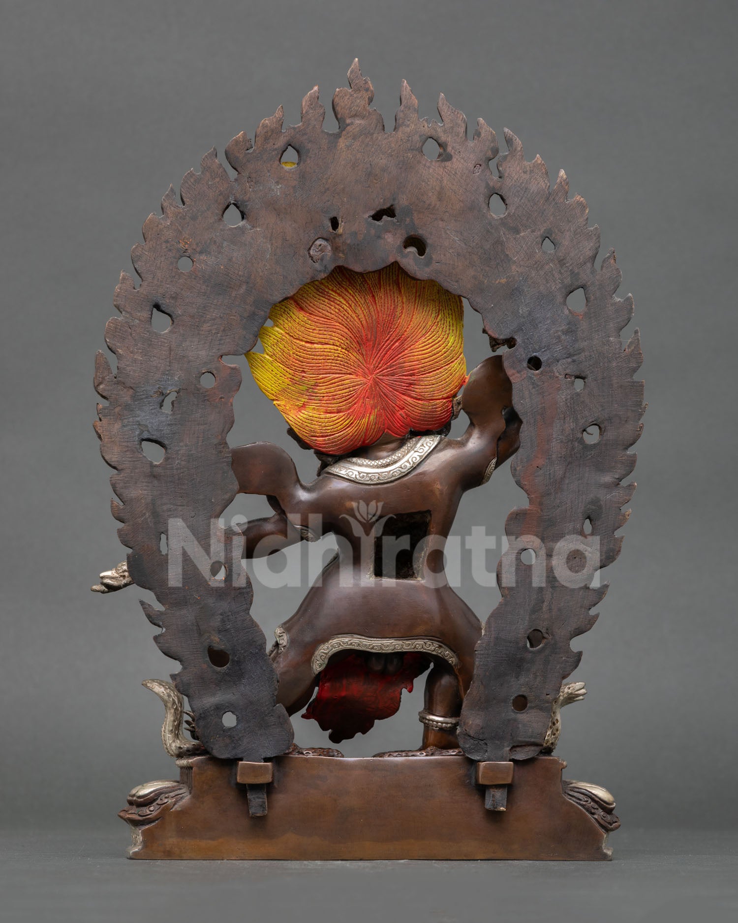 Back view of Trakpo Sumtril statue showing flowing robes, flaming aura details and fine copper craftsmanship