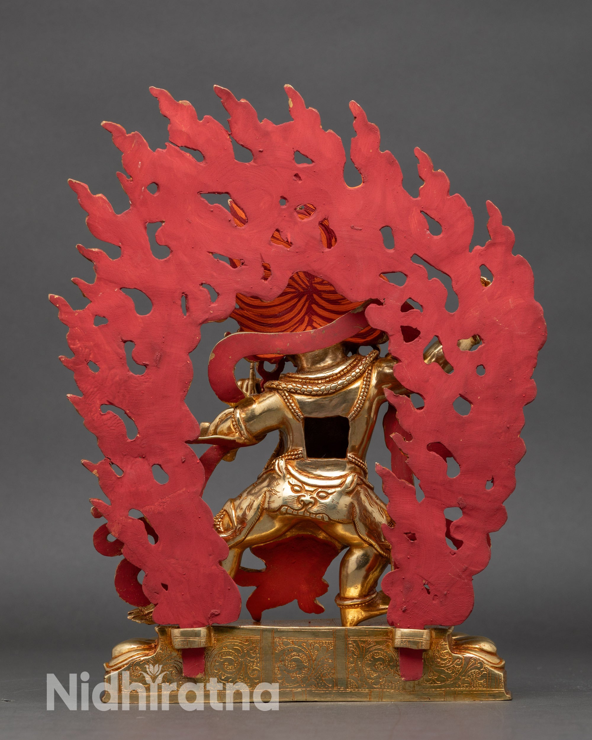 Back view of Vajrapani statue with gold-plated halo and vibrant acrylic decorations"