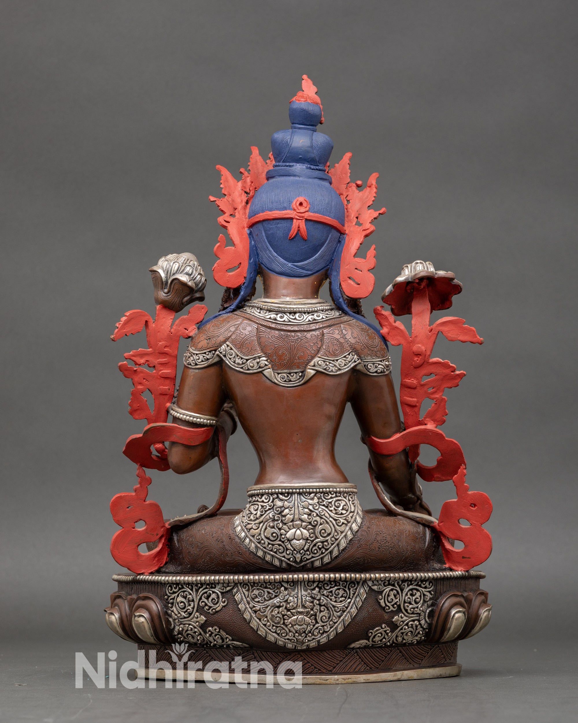 Back view of White Tara Buddhist sculpture showing intricate Newari artisan crafting