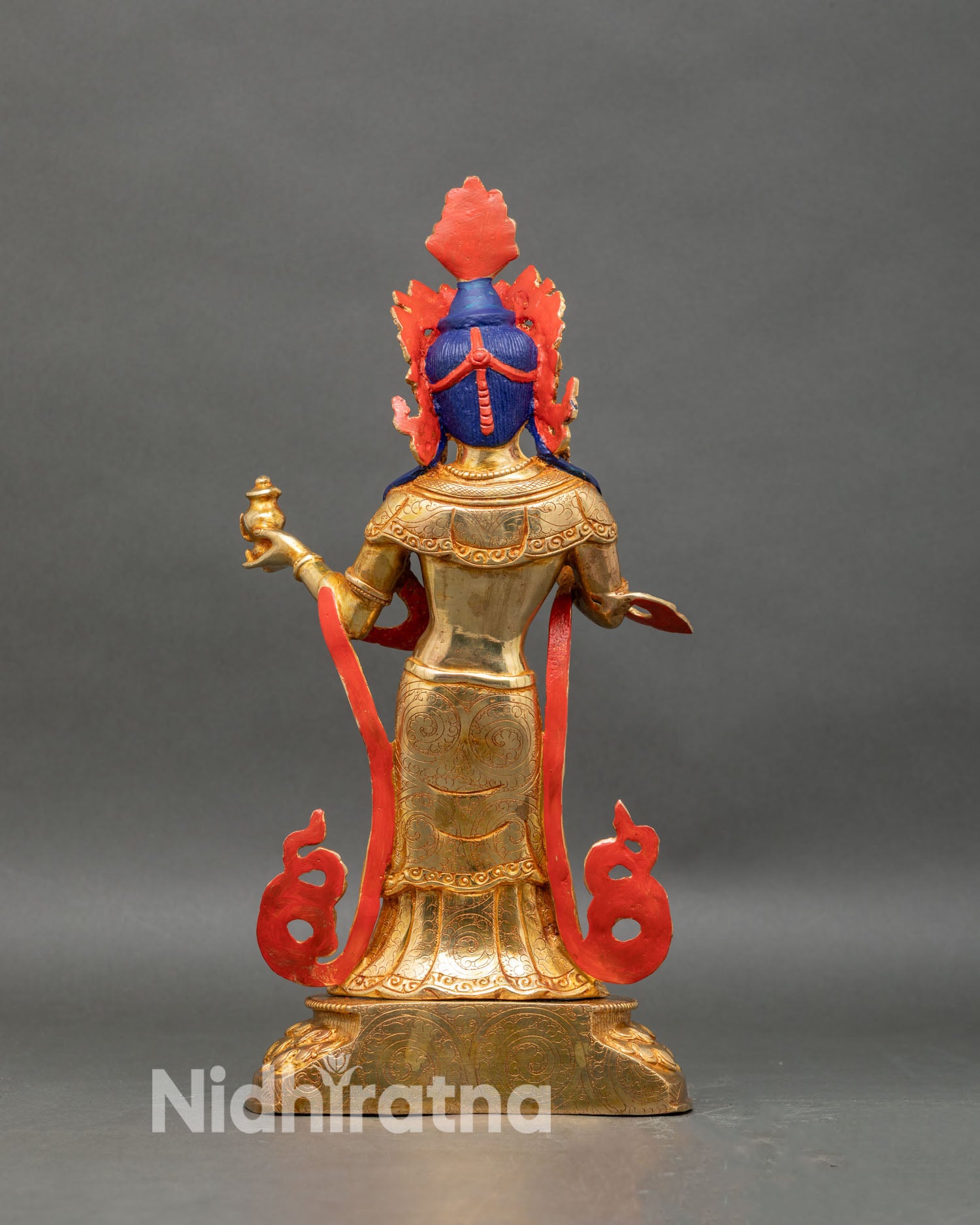 Back view of Yeshe Tsogyal statue, engraved scarves and traditional Newar motifs