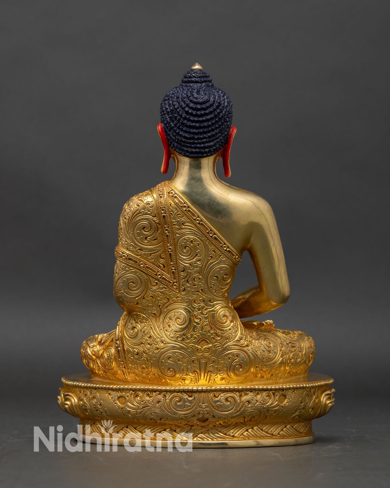 Back view of Amitabha Buddha statue, ornate lotus seat and repousse robe details