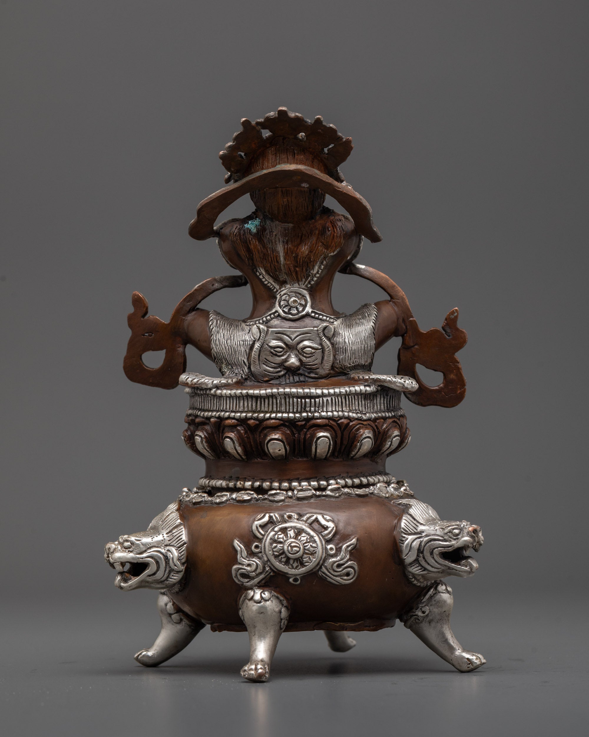 Back-view of Detailed Shot of Vajradhaka’s Silver-Gilded Face and Fiery Adornments