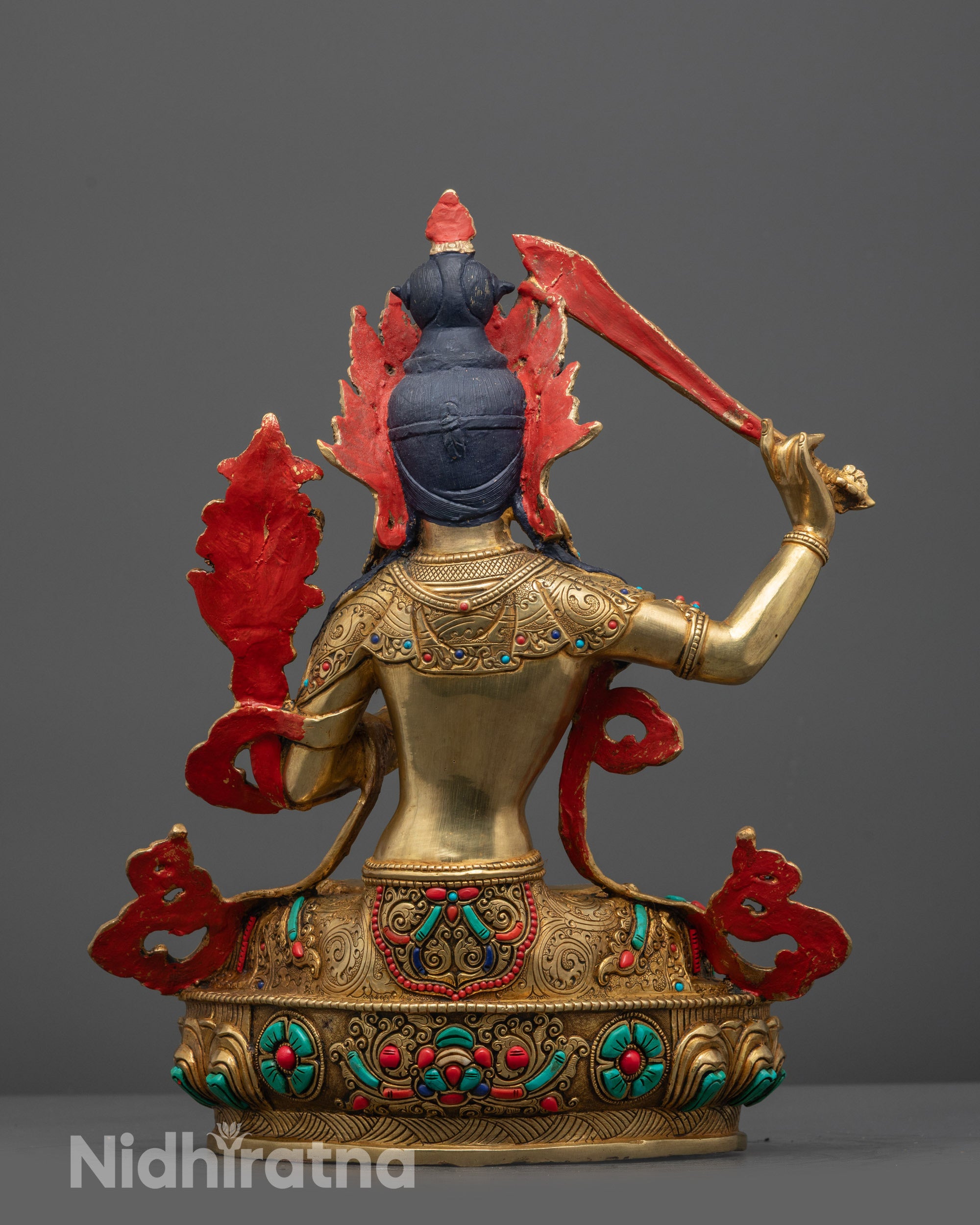 Back-view of Intricately detailed Manjushri statue with serene expression
