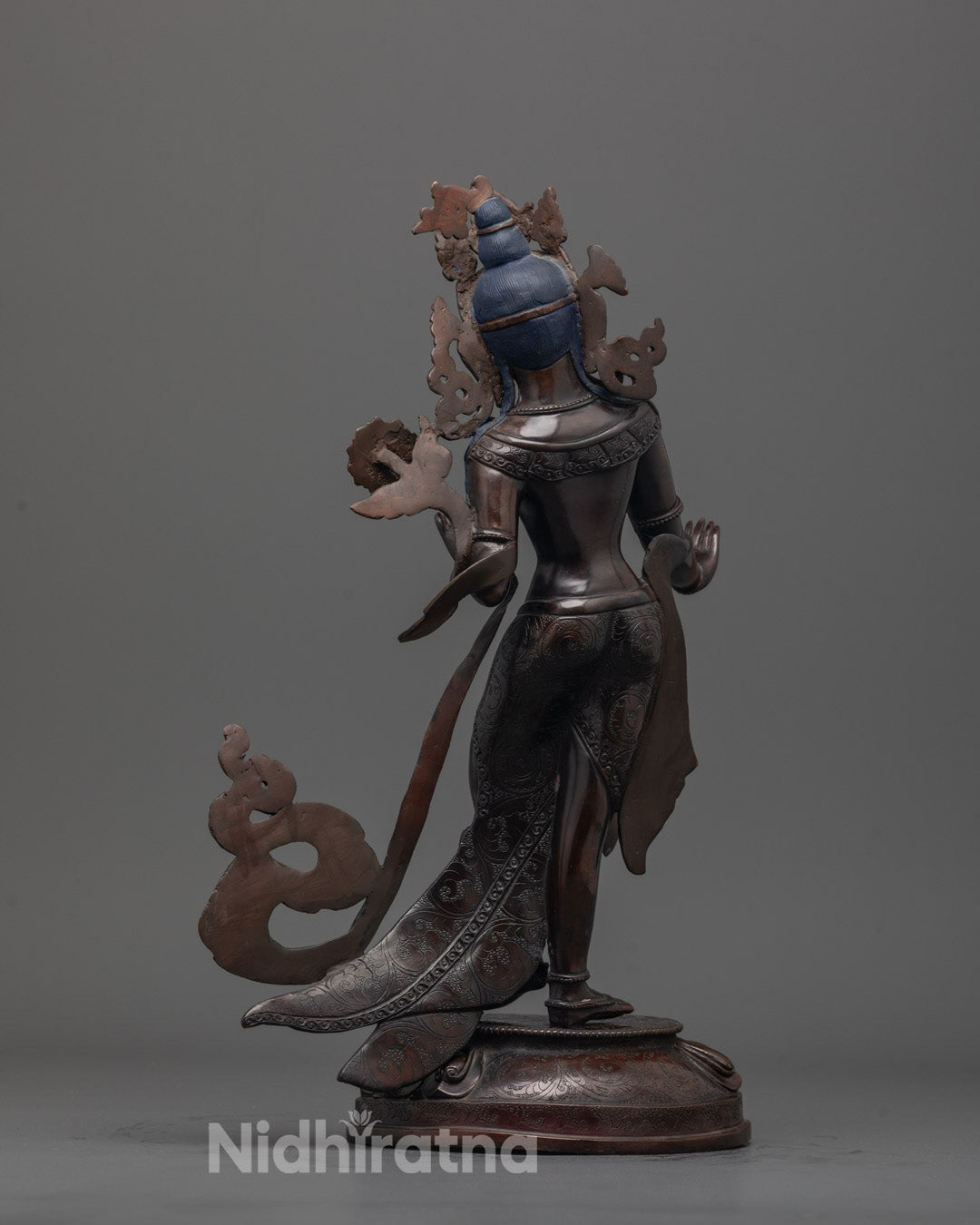 Back-view of Oxidized copper White Tara statue handcrafted in Patan, Nepal