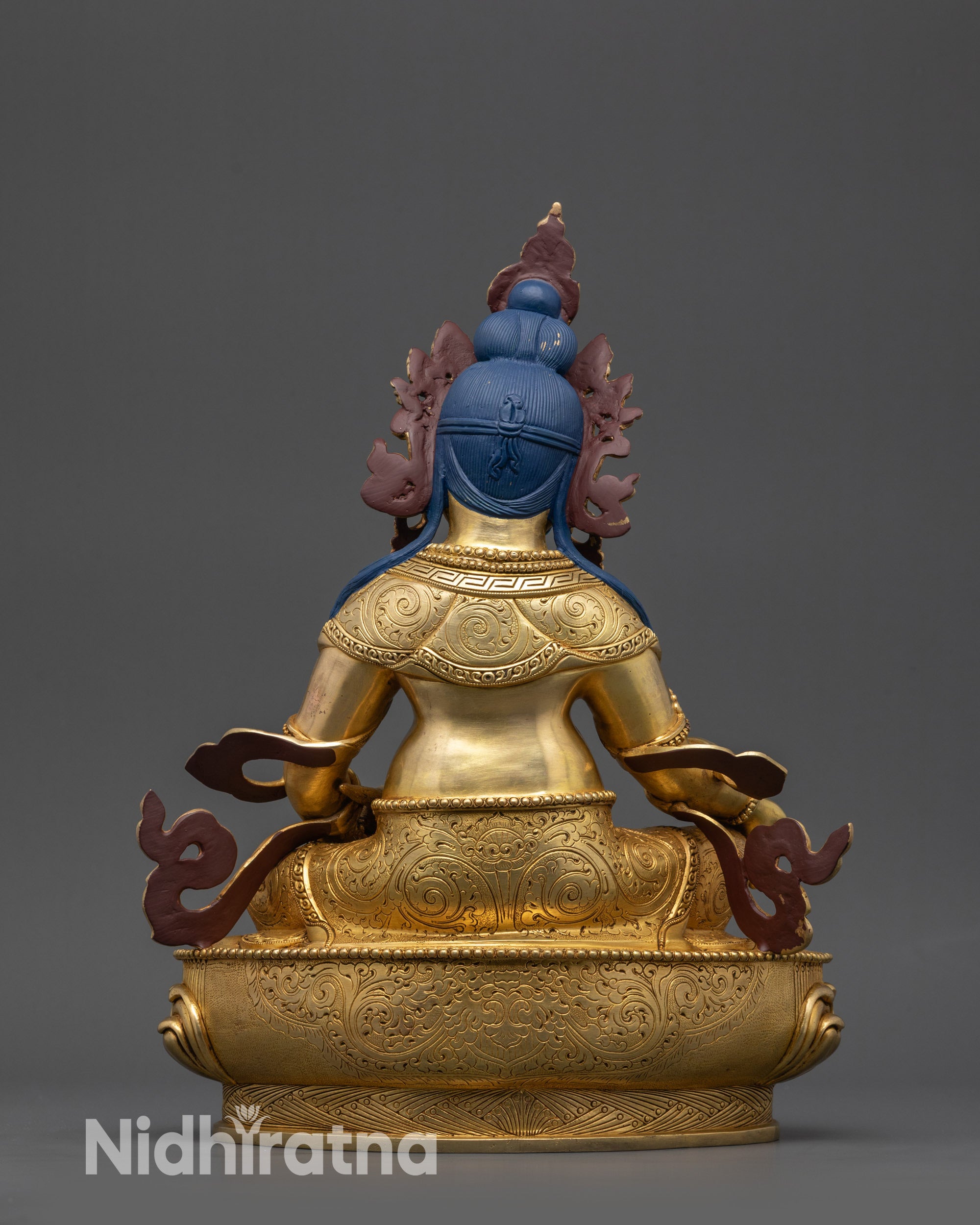 Back View of Himalayan Dzambhala Statue with Intricate Carved Robe Details