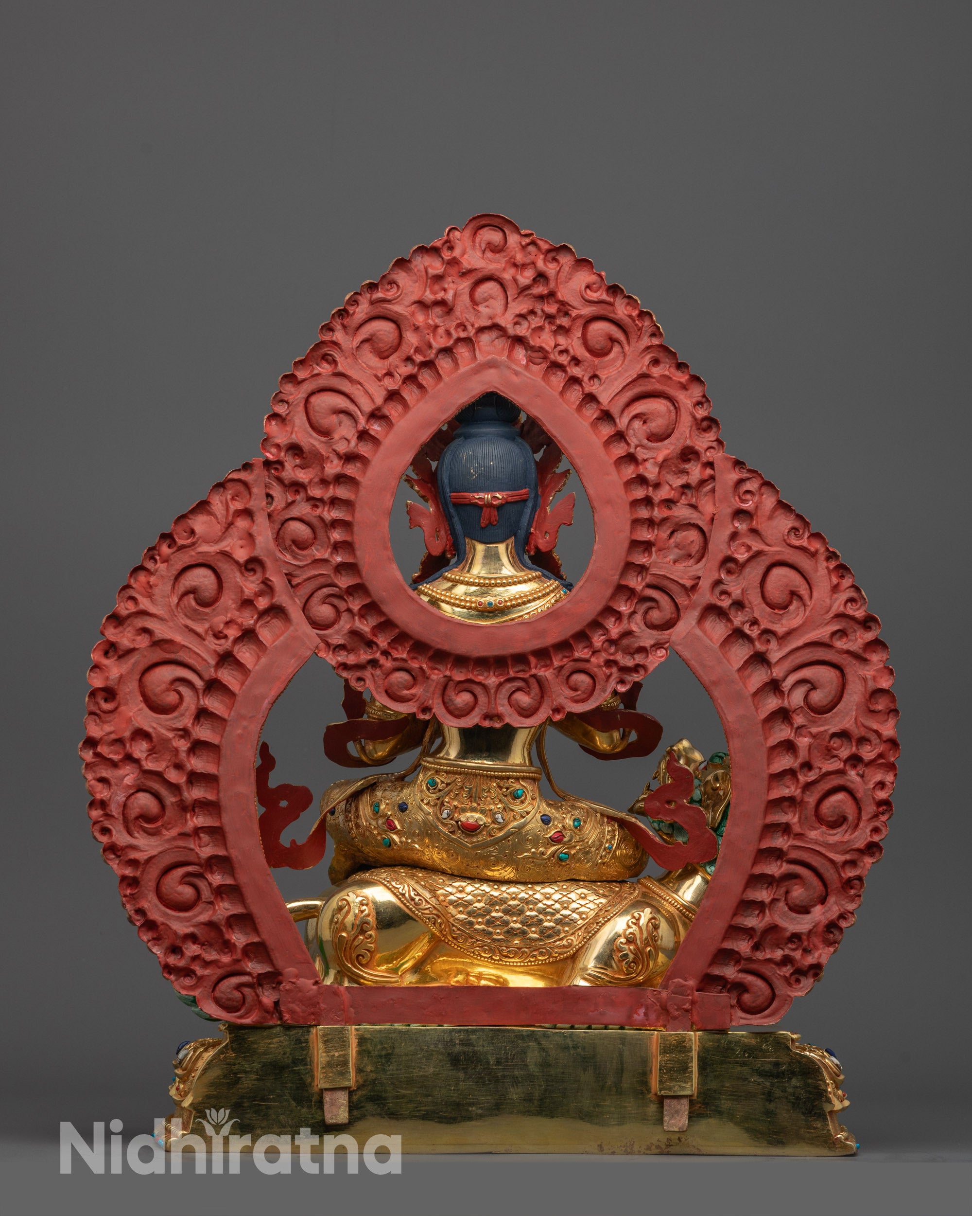 Back View of Tibetan Manjushri Statue Highlighting Intricate Halo