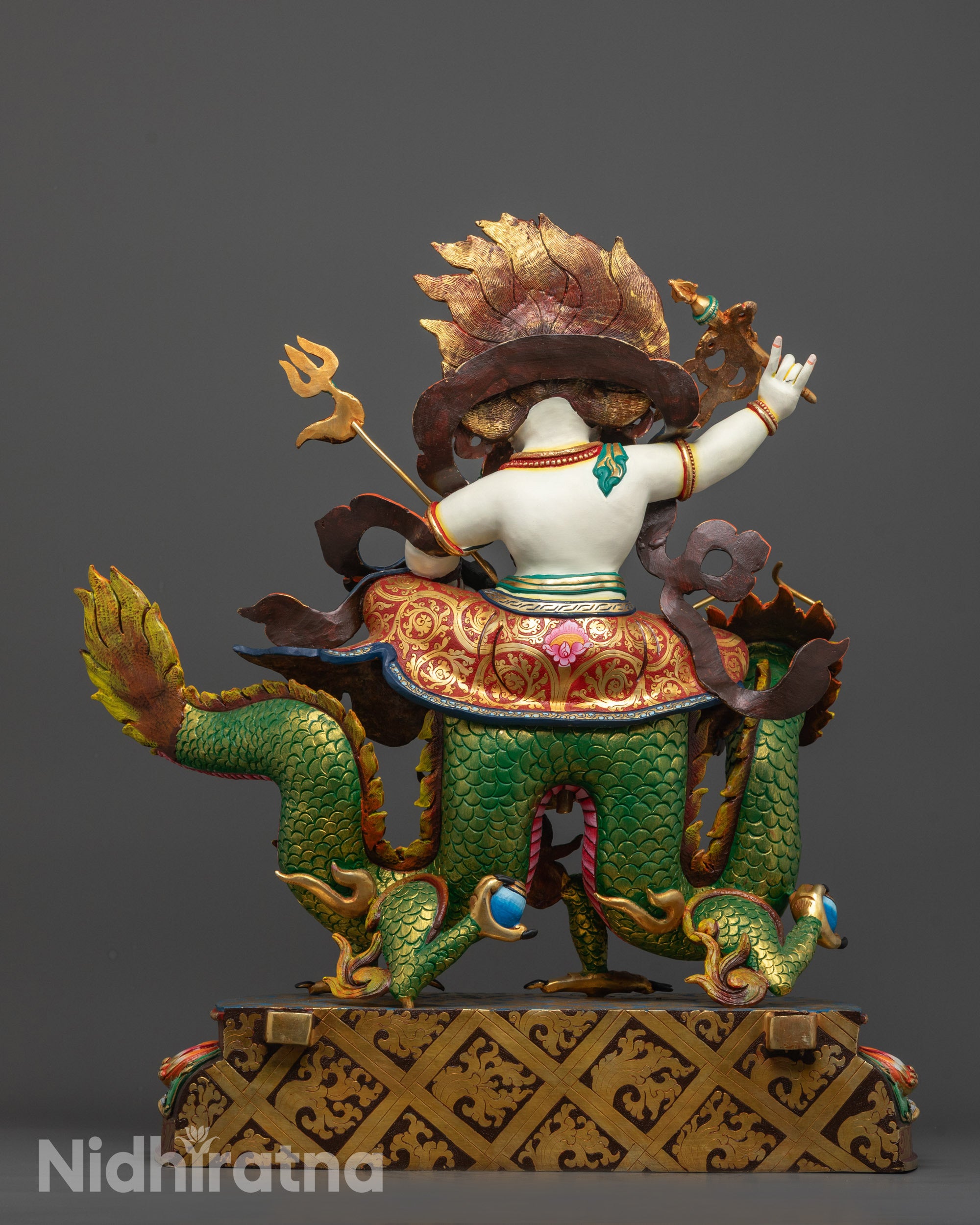 Back View of White Dzambhala Statue Featuring Intricately Designed Halo