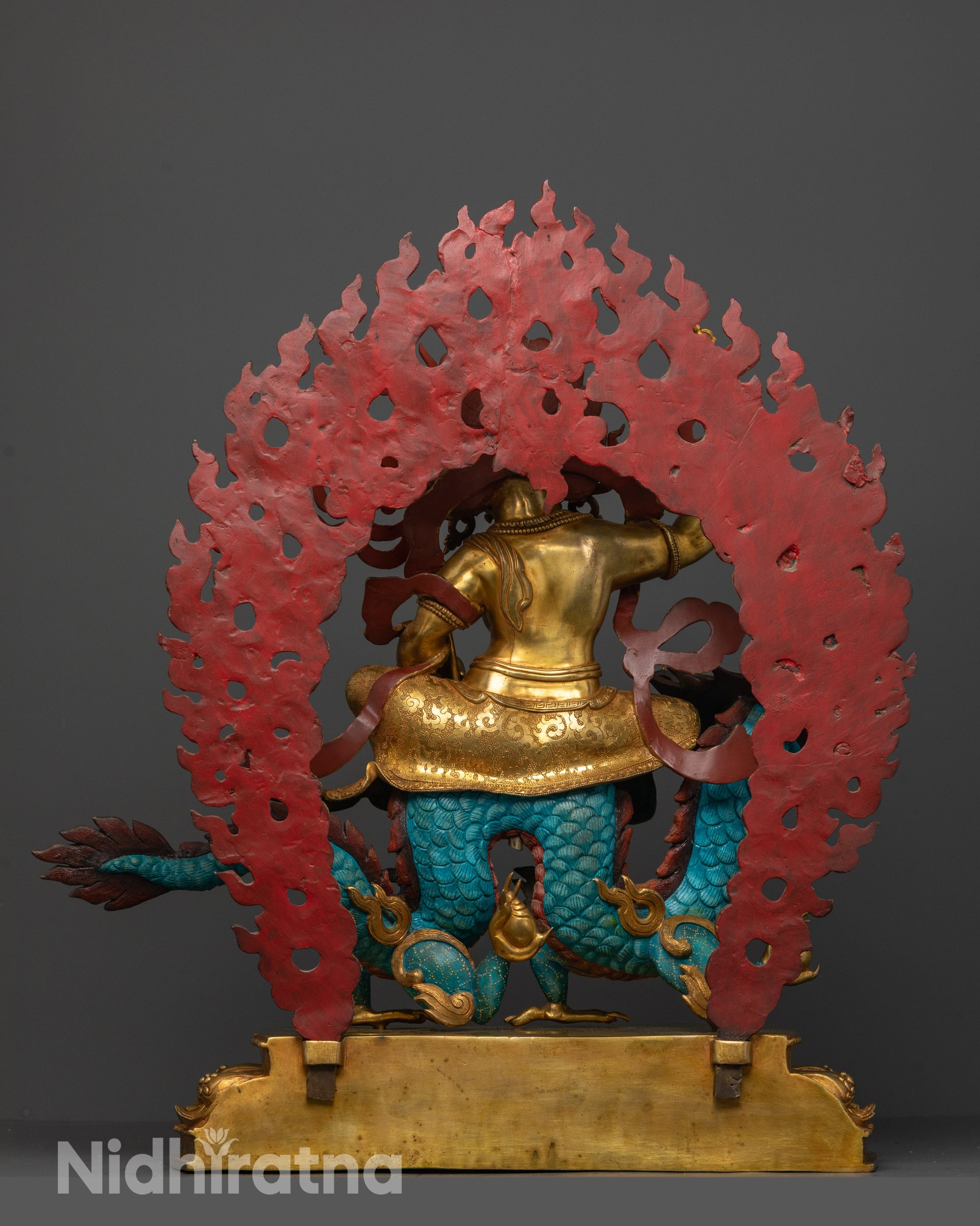 Back View of White Dzambhala Statue Featuring Sacred Halo and Detailed Robe Carvings