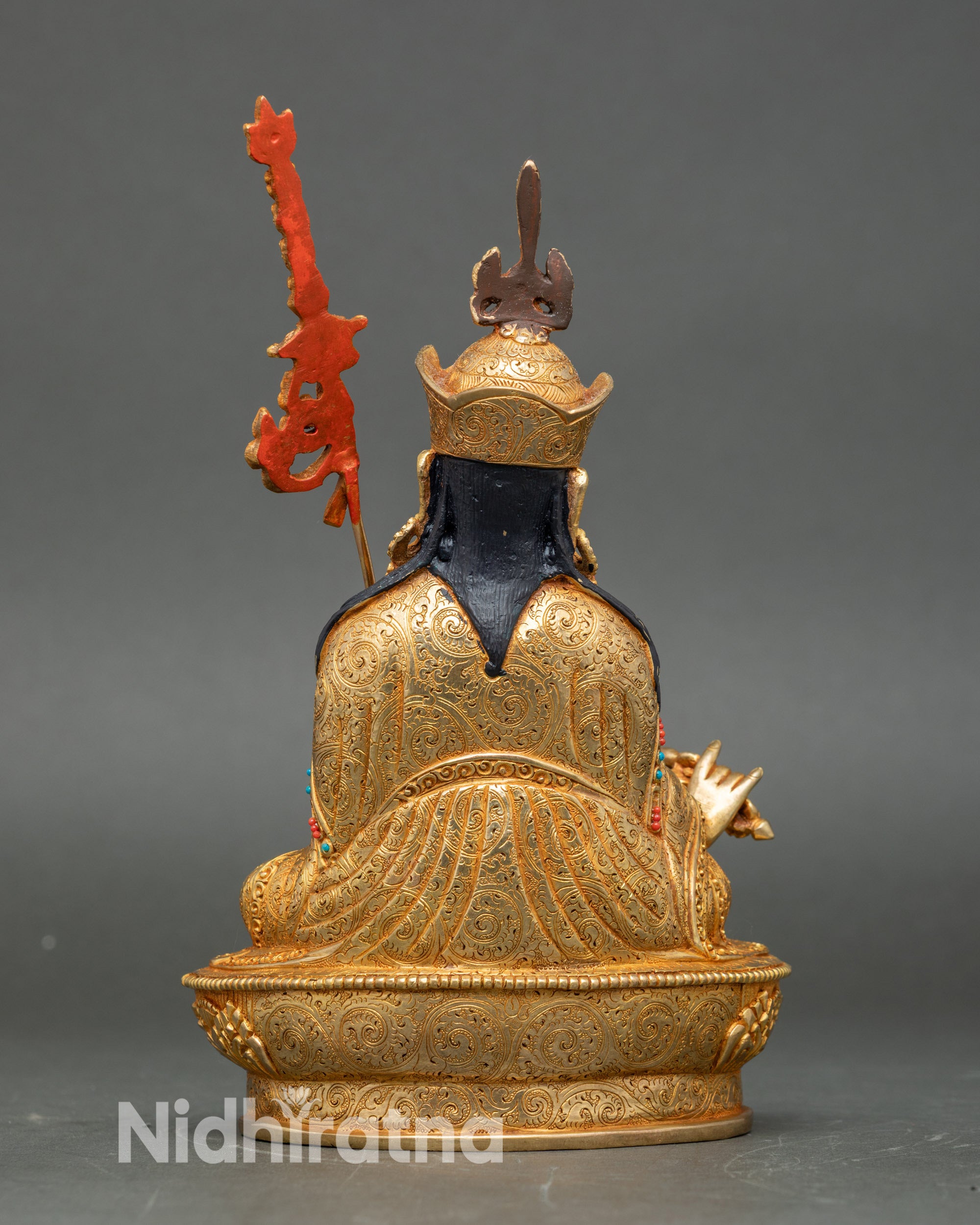 Back and detail view of Nepalese Guru Rinpoche statue, showcasing lotus throne, gold gilding, and sacred Tibetan Buddhist symbolism.