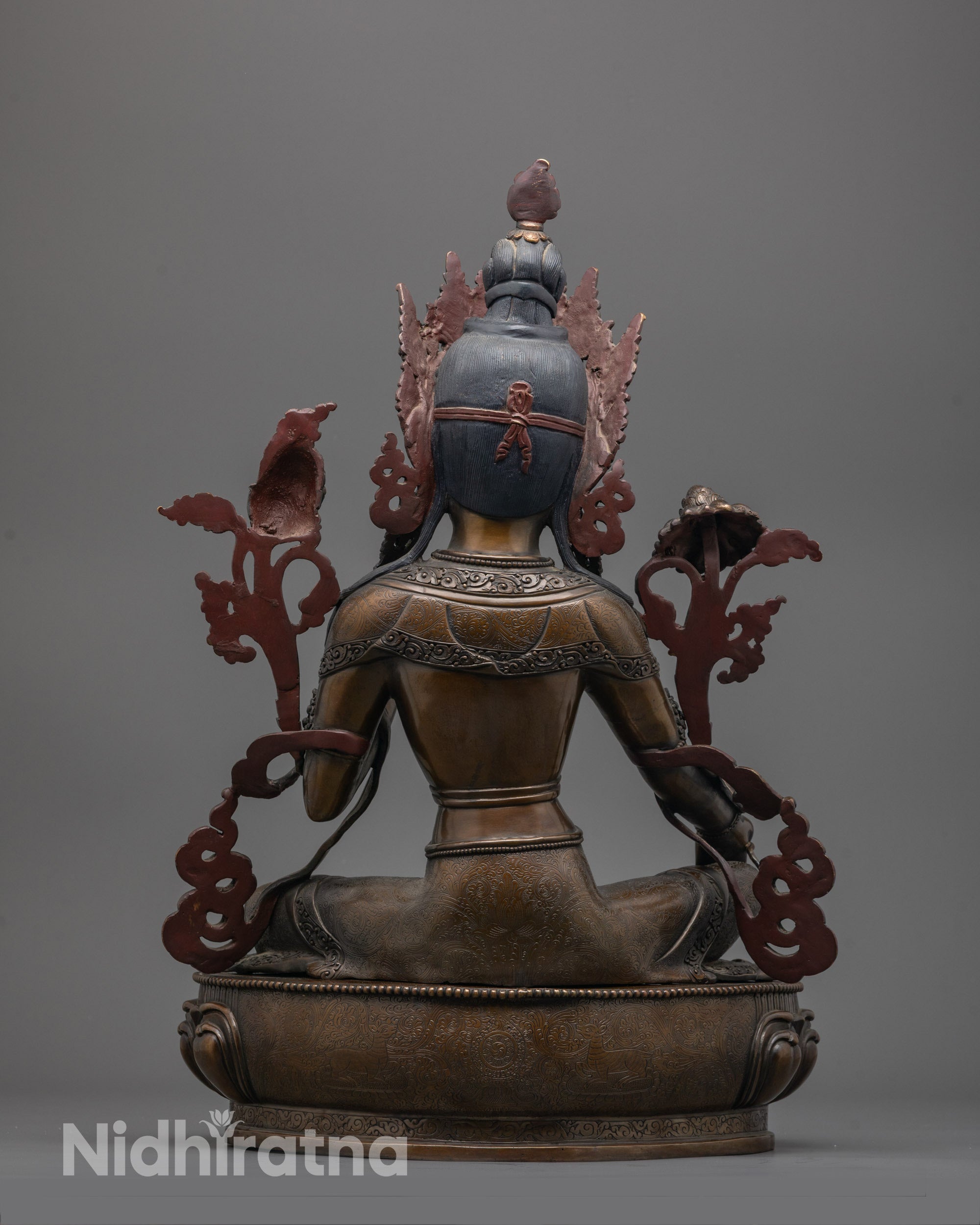 Back of Green Tara Statue in oxidized copper showing robe details and traditional craftsmanship