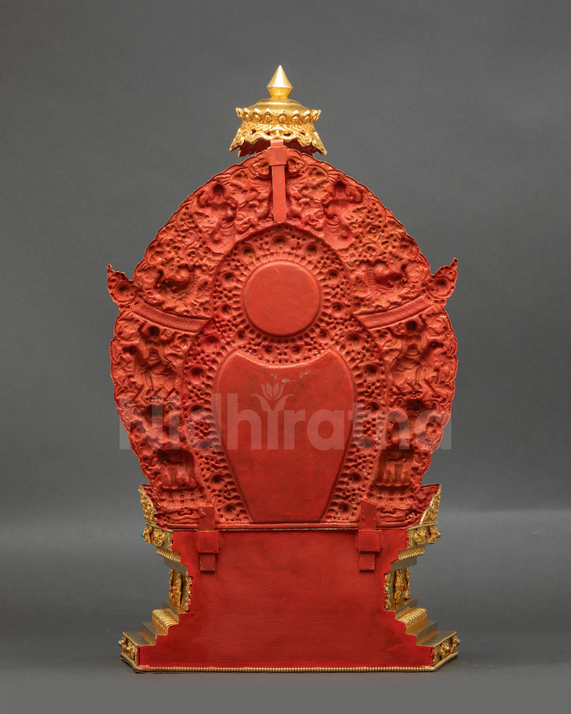 Back of Green Tara statue showing ornate Vajrayana throne and halo