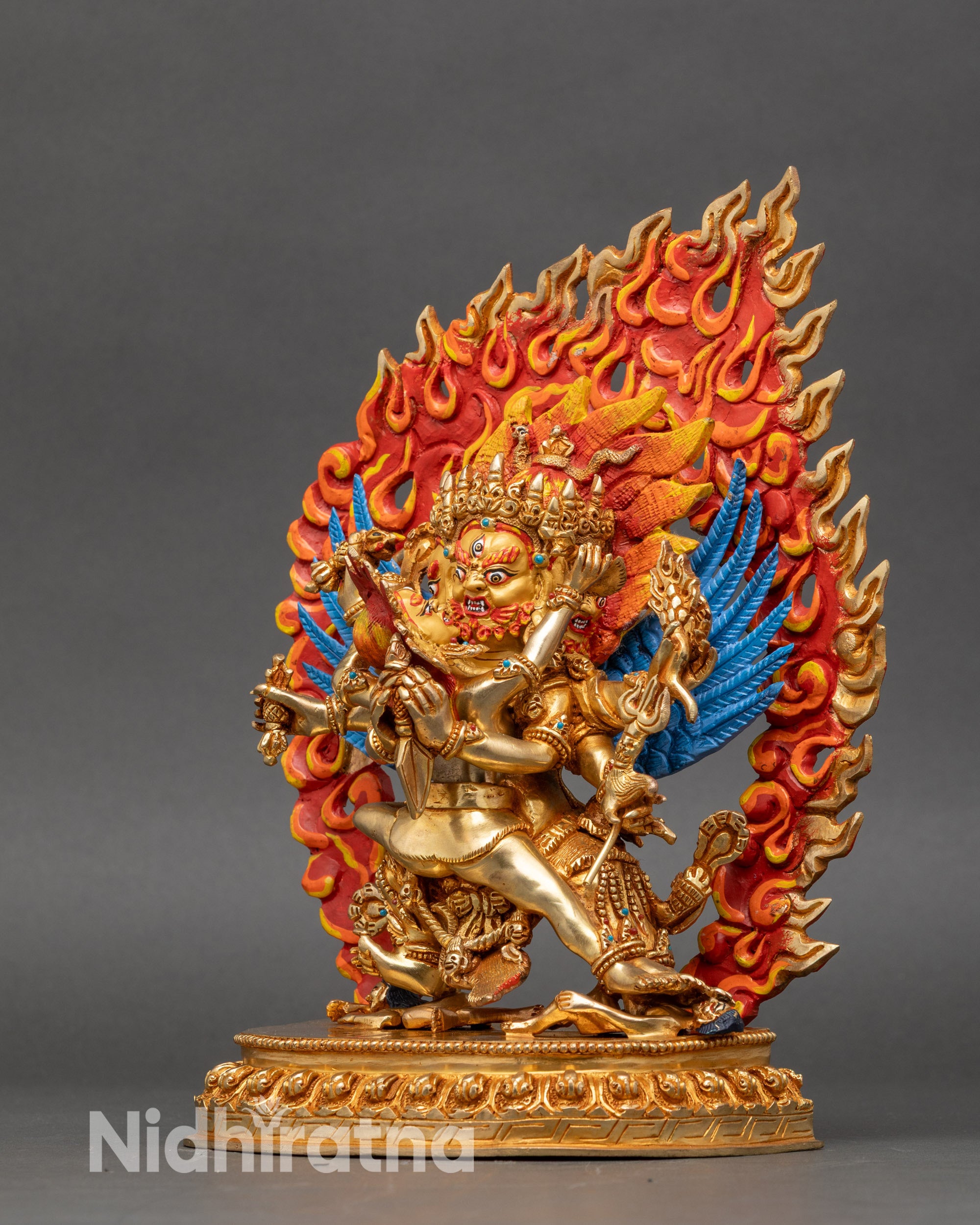 Back of Hayagriva statue with carved wings and decorative flaming halo