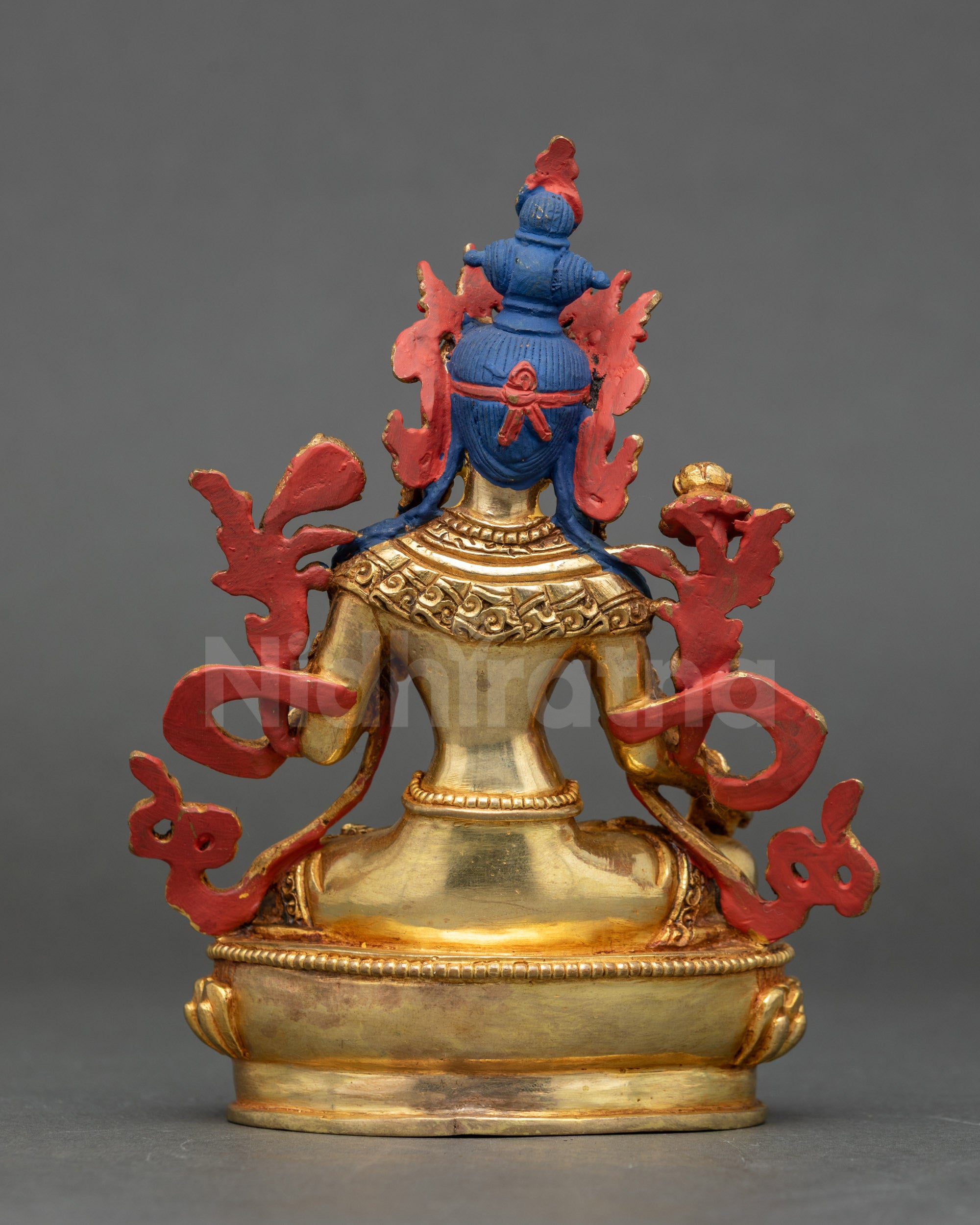 Back of Himalayan White Tara Statue showing intricate robe patterns and lotus pedestal