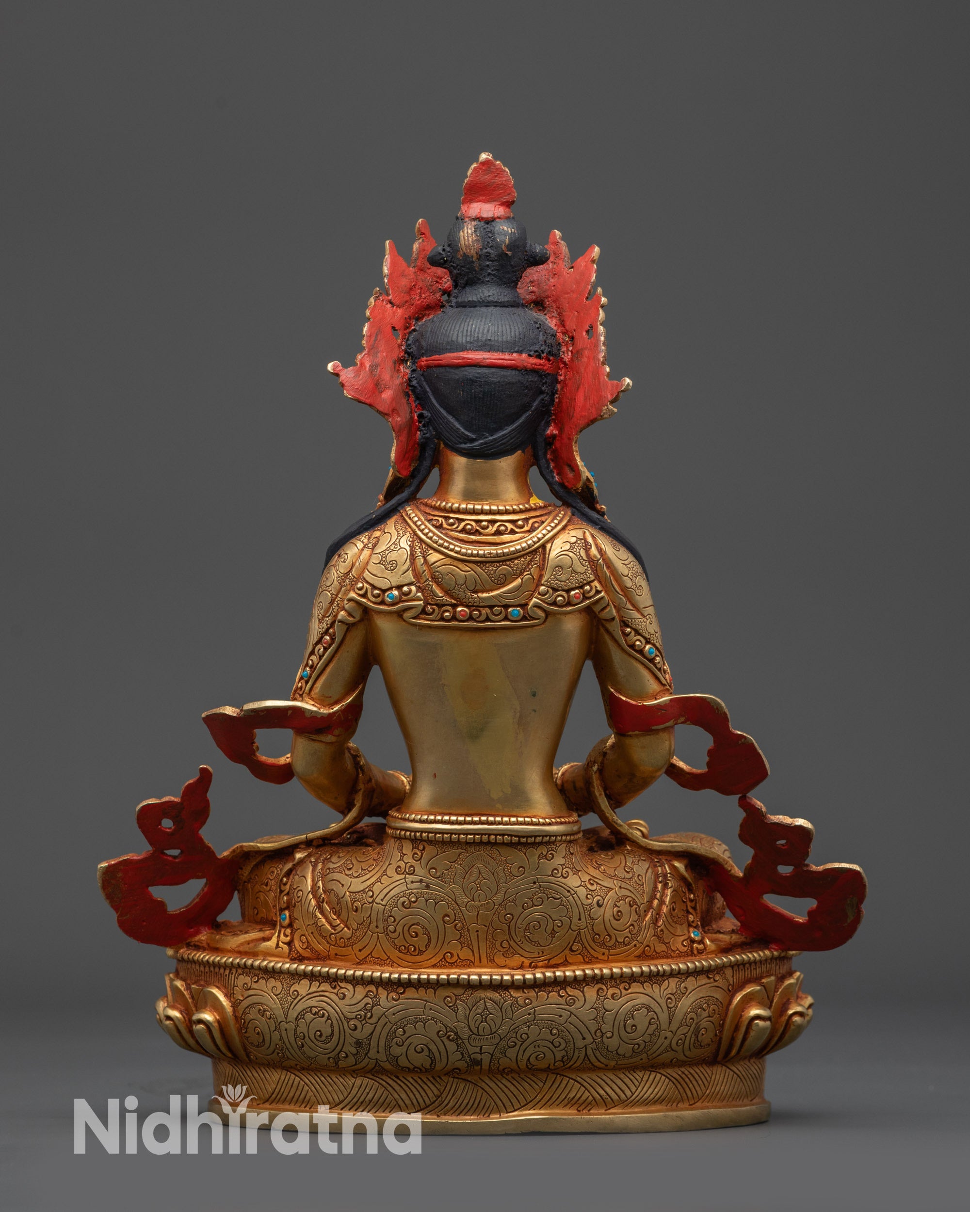 Back view Amitayus Buddha statue revealing carved robe and decorative halo